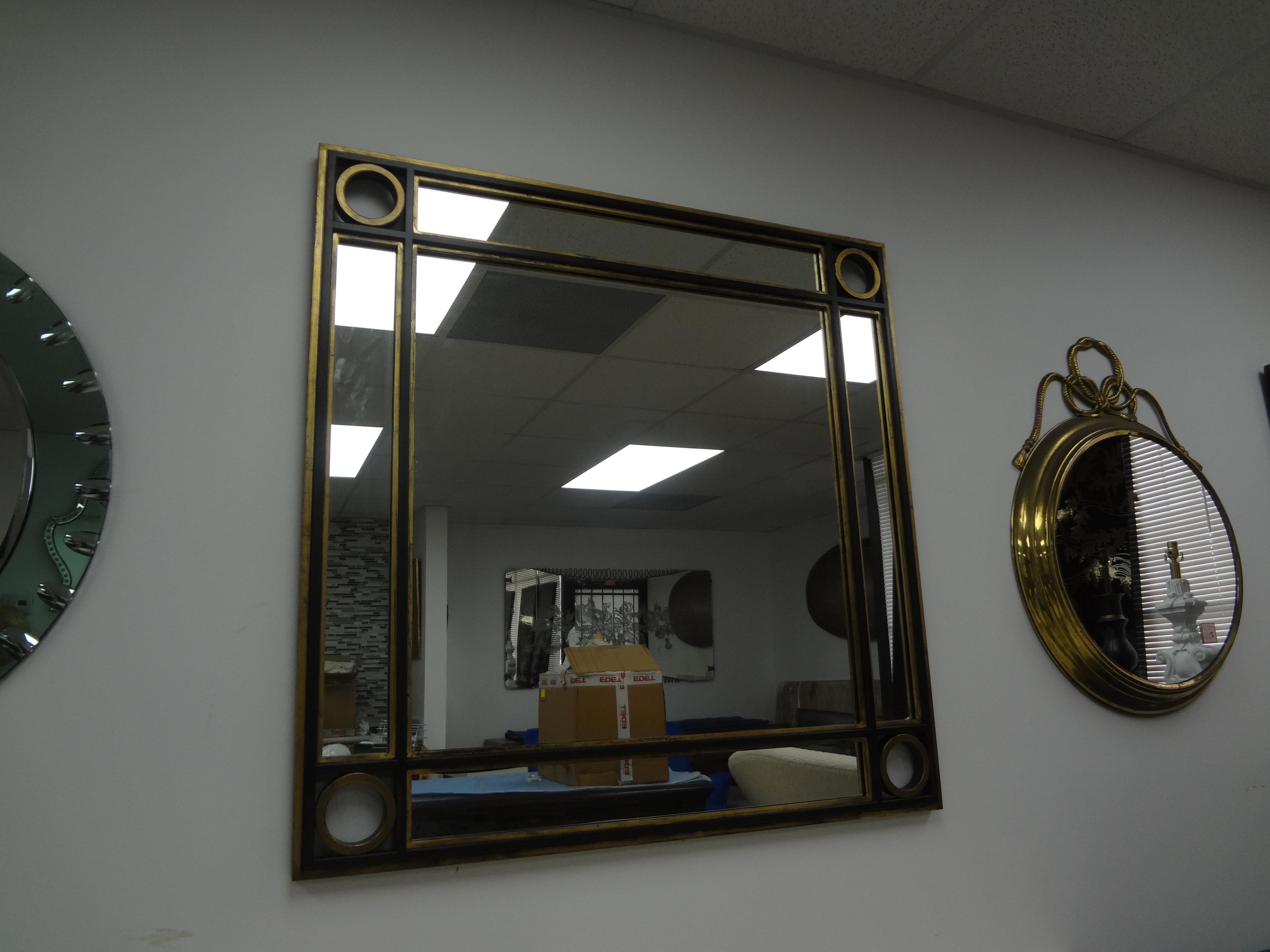 Vintage Italian Mid Century Square Iron Mirror.
Our handsome large Italian Hollywood Regency mirror was executed in wrought iron painted black and gilt with divided mirror perimeter.
A perfect mirror where a square mirror fits the bill!
Chic and