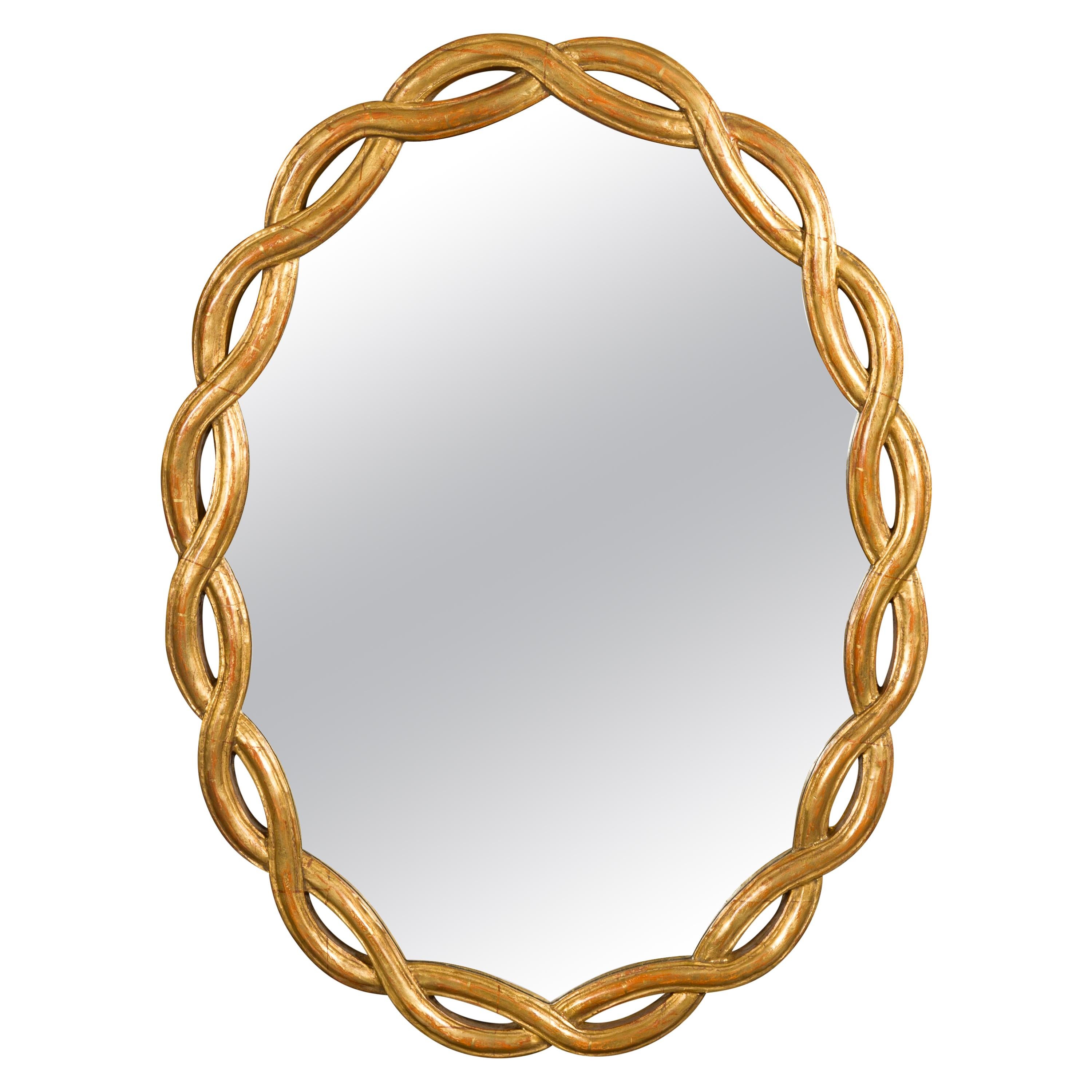Vintage Italian Midcentury Giltwood Oval Mirror with Intertwining Motifs