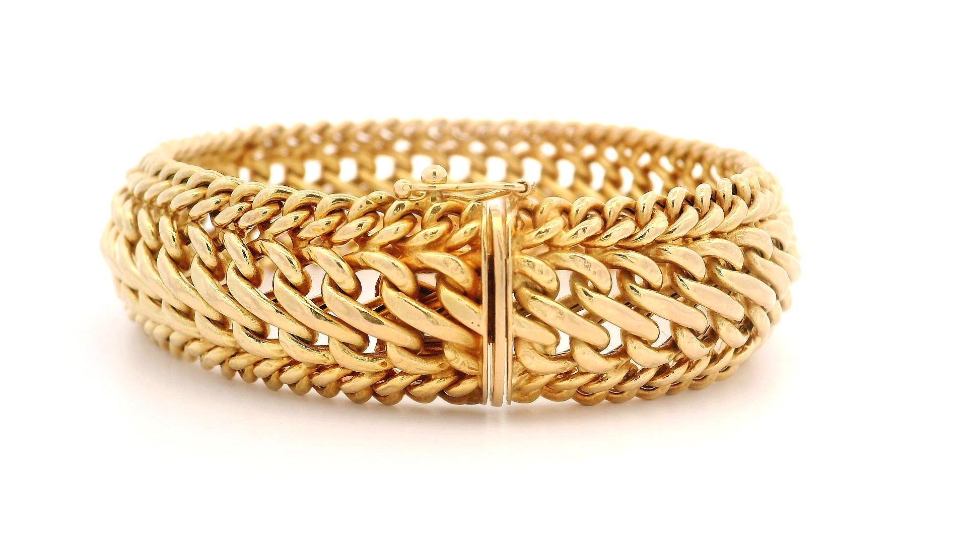 Material: Solid 14k Yellow Gold
Weight: 20.62 Grams
Chain Type: Domed Interlocking Curb Link
Chain Length: Measure 7.25 Inches Next to a Ruler. Will comfortably fit up to a 6.75 Inch wrist (fitted on a wrist)
Chain Width:	16.4mm (0.64