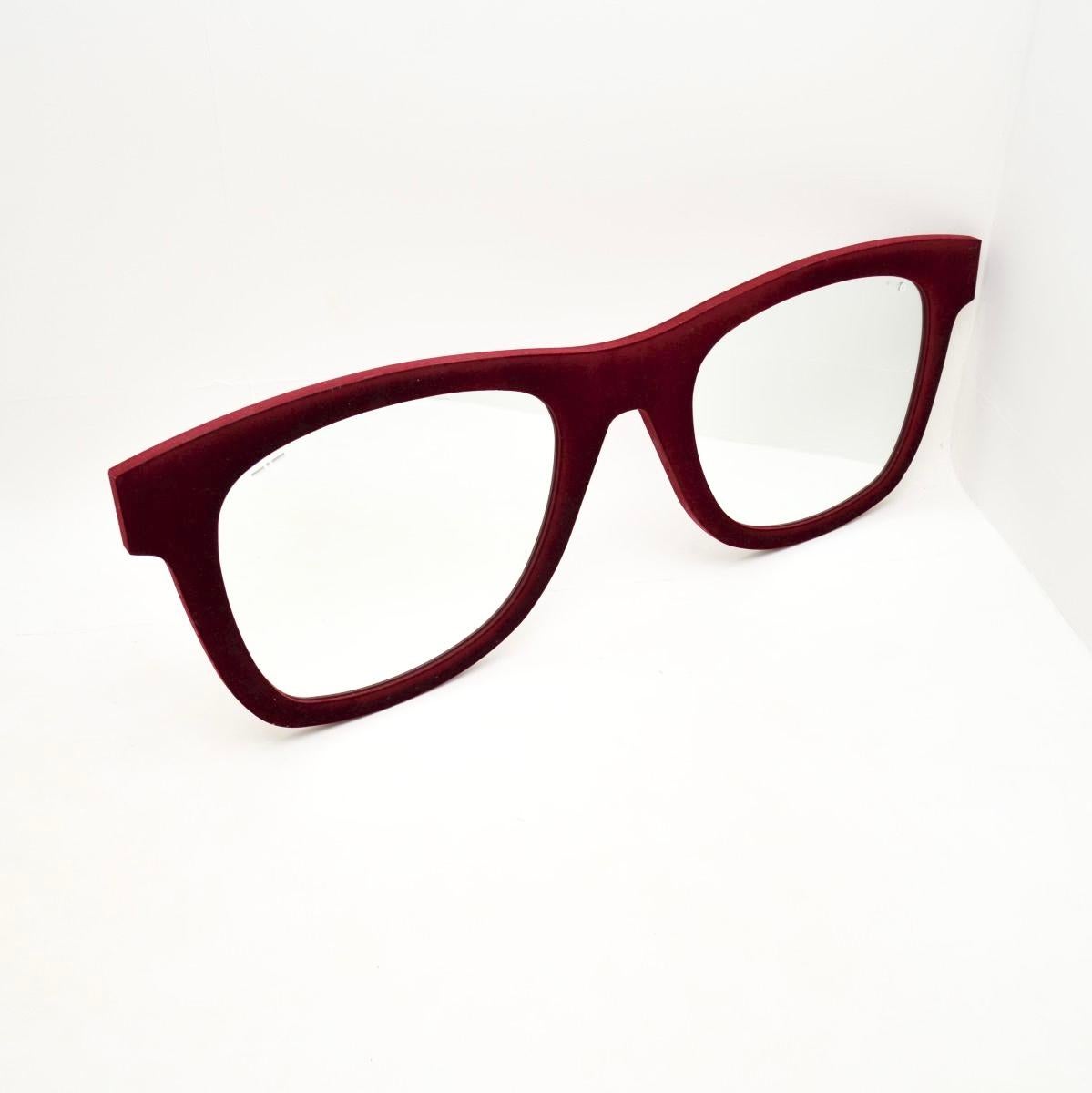 A wonderfully stylish and quirky vintage Italian mirror by Meritalia and Lapo Elkann , dating from the 1980’s.

This is beautifully designed as a pair of large glasses, covered in a burgundy velvet fabric. It is a super striking and interesting