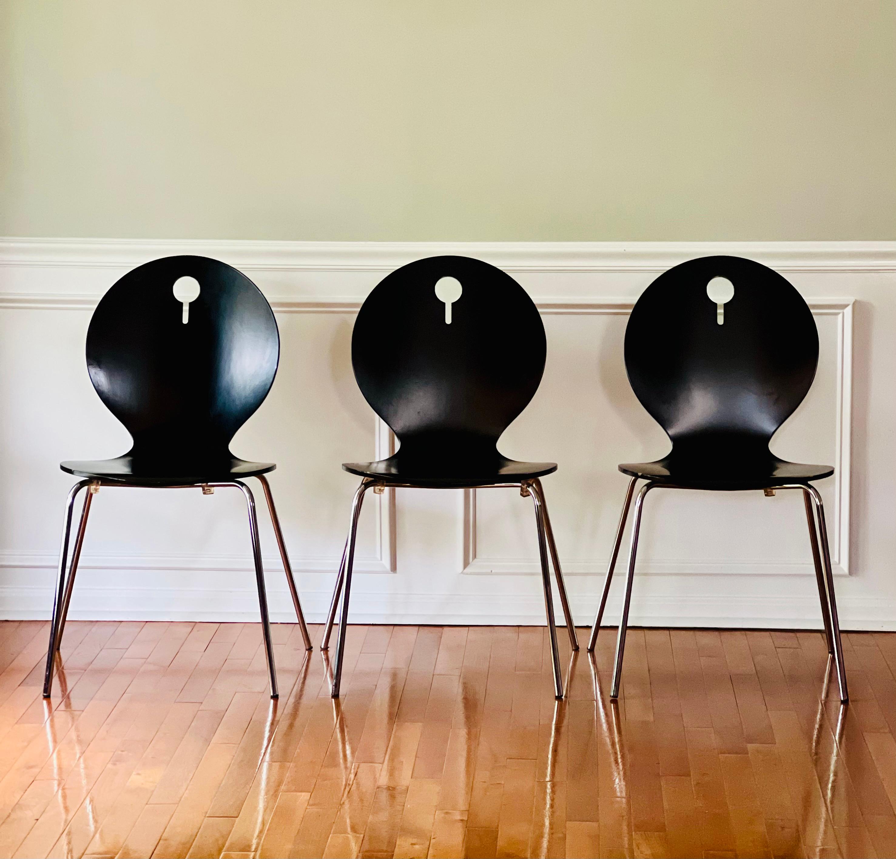 Set of 4 Italian modern stackable bentwood chairs by Calligaris, Italy. 

These versatile chairs are comfortable and ergonomic with a clean, minimalistic design. They feature a decorative cutout in the backrest and a conventional chrome base.