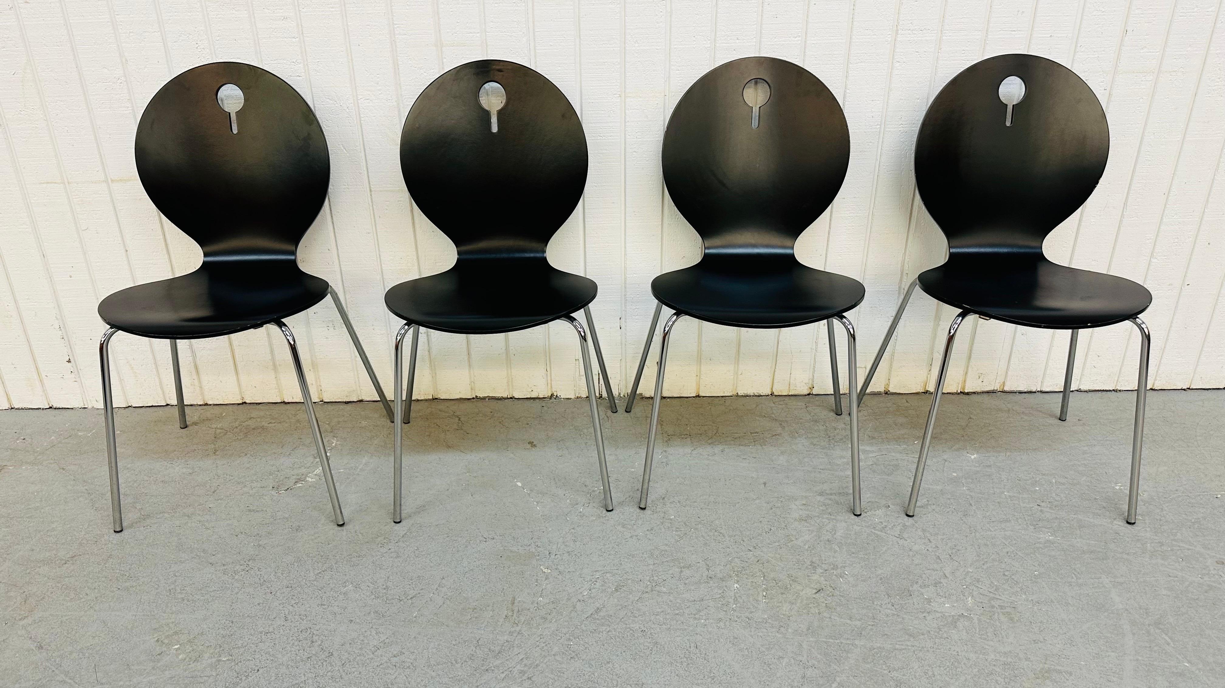 This listing is for a set or four vintage Italian Modern Bentwood Stacking Chairs. Featuring a black bent plywood frame, chrome legs, and the ability to stack on top of each other for easy storage.