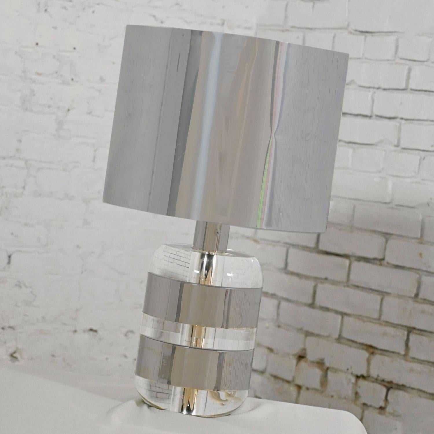 Stunning vintage Italian modern Lucite and chrome table lamp with polished aluminum shade, chrome shaft, and solid Lucite and chrome stacked discs by Noel B.C. Italy. Beautiful condition, keeping in mind that this is vintage and not new so will have