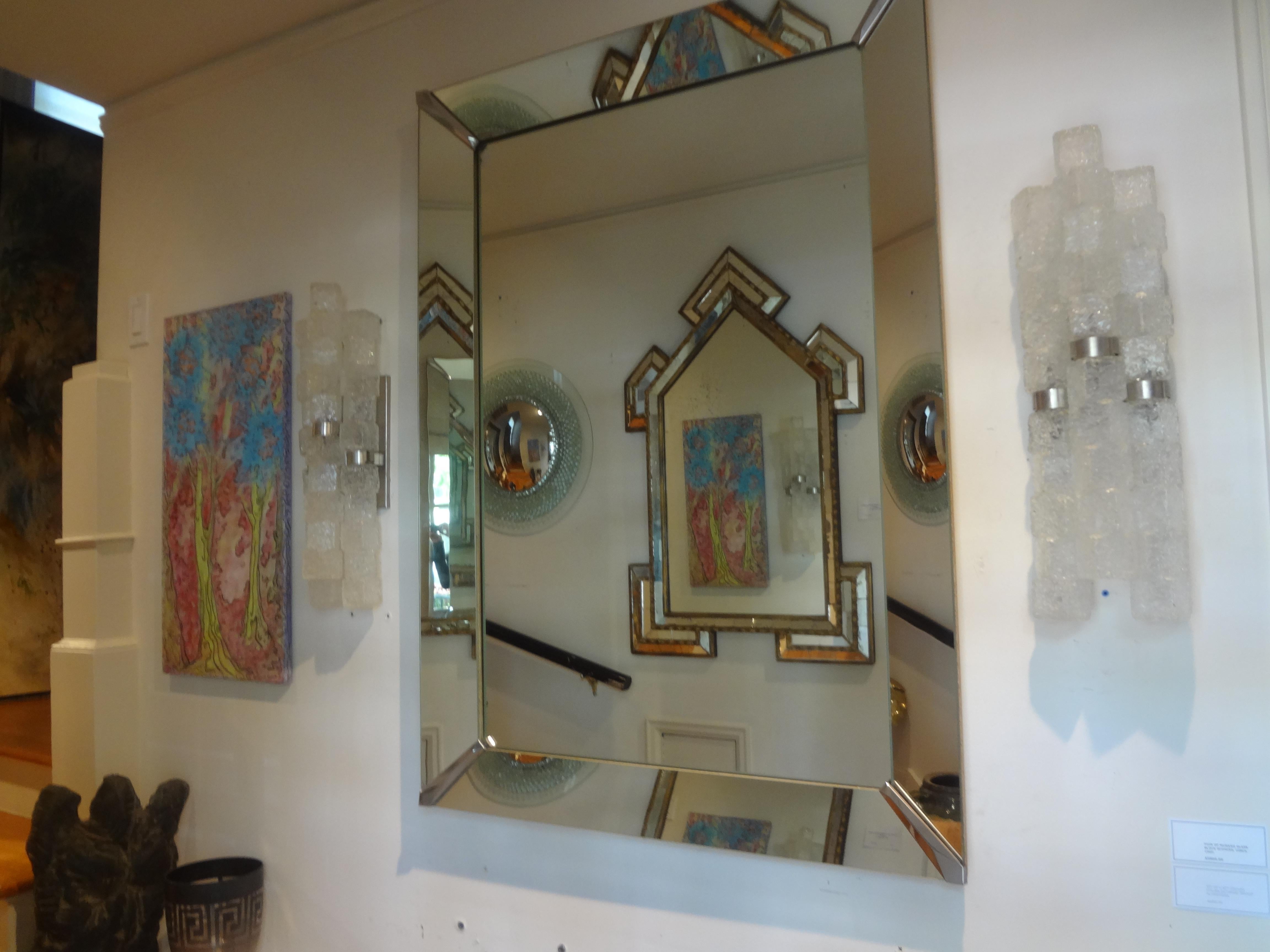 Vintage Italian Modern Venetian Style mirror.
Large mid century Italian rectangular three dimensional mirror with chrome corners.
This lovely mirror can be displayed either way, vertically or horizontally.
The clean lines of his vintage mirror