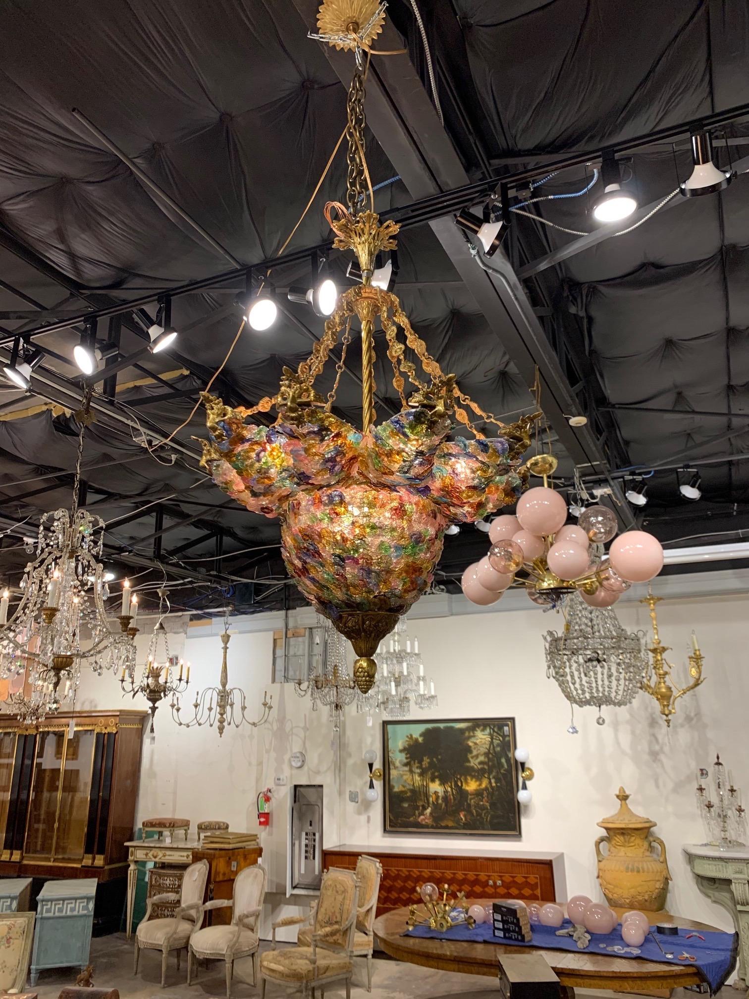 Very unique vintage multicolored Murano glass and bronze chandelier. Vivid colors and a bold textural look to this fixture. A real conversation piece!!