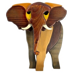 Vintage Italian multicolored elephant sculpture in thick wood. Italy 1980s