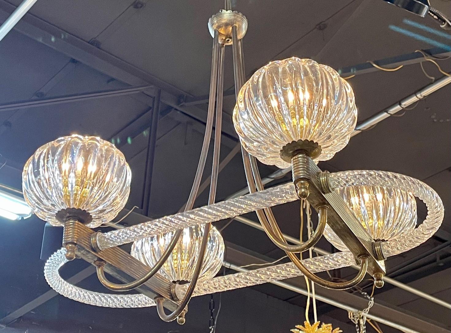 Vintage Italian Murano glass and brass 4 light chandelier after Barovier and Tose. Circa 1960. The chandelier has been professionally re-wired, cleaned and is ready to hang. Includes matching chain and canopy.