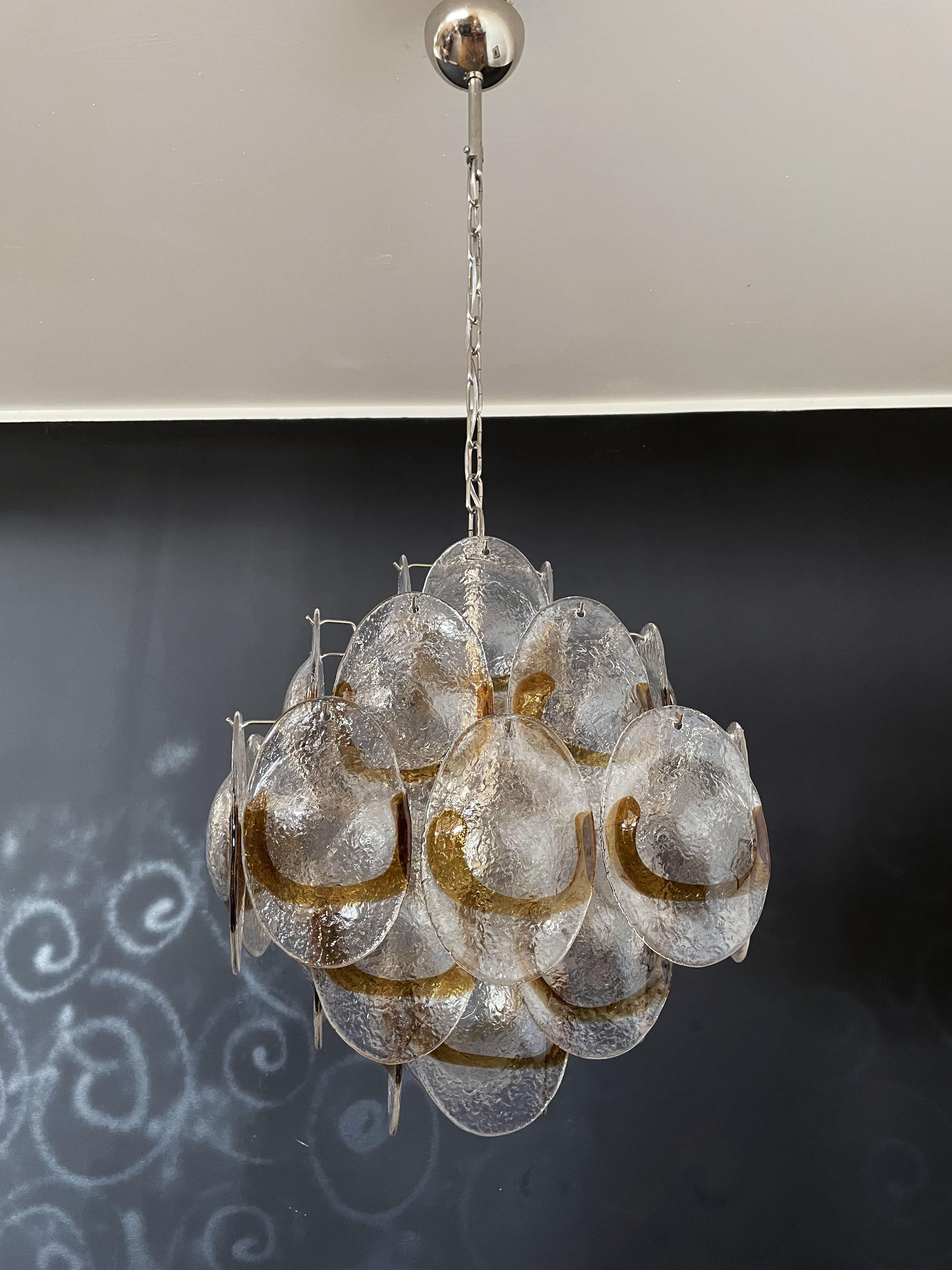 Vintage Italian Murano chandelier in Vistosi style. The chandelier has 36 fantastic trasparent and amber glasses 