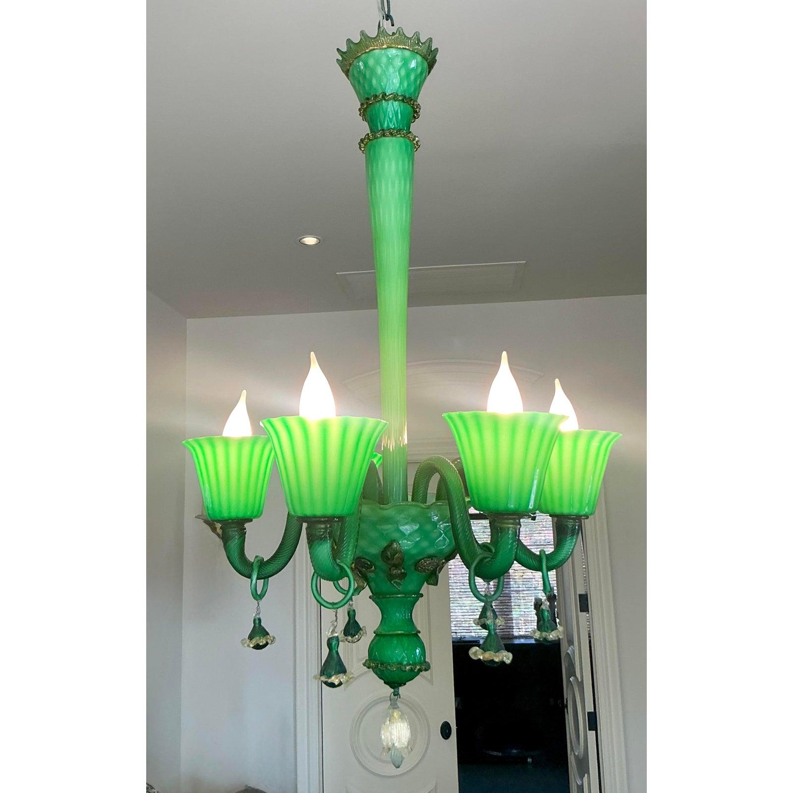Presenting a stunning vintage Italian Murano Glass Chandelier, a vibrant testament to exquisite Venetian craftsmanship. This dazzling fixture is rendered in a rich emerald green, beautifully accented with delicate gold detailing, creating a