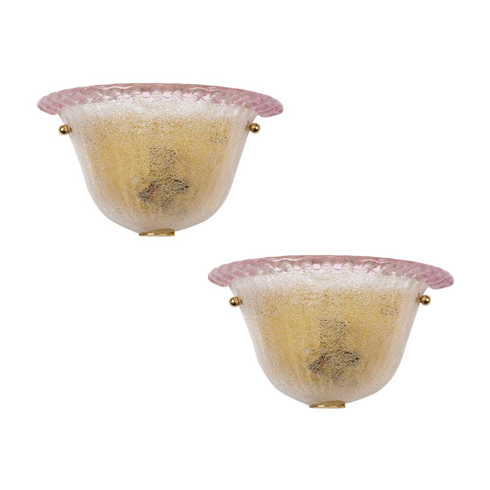Add a touch of vintage Italian elegance to your space with our extraordinary pair of vintage wall sconces, masterfully crafted from Murano glass. In great condition and newly wired to meet US standards, these sconces are poised to illuminate any