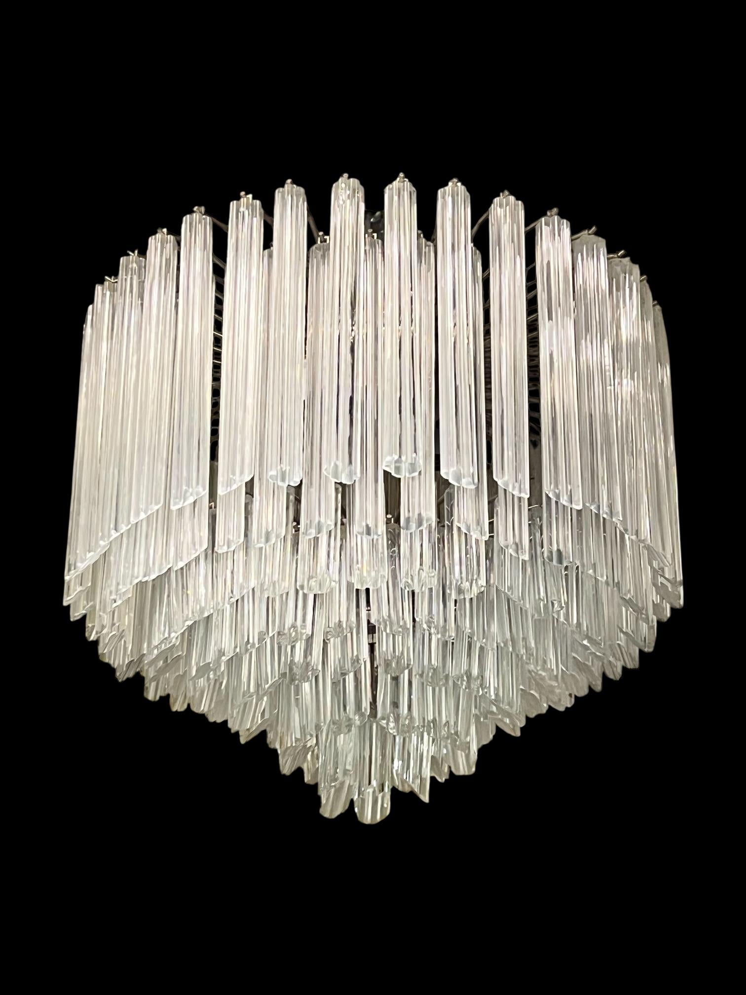 Vintage Italian Murano glass chandelier of circular shape featuring over 150 rare Murano crystal glass hexahedron shaped pendants (prisms) ranging from 4 in (100 mm) to 11 in (280 cm) in length.  20 inches across and 22 inches tall, with six