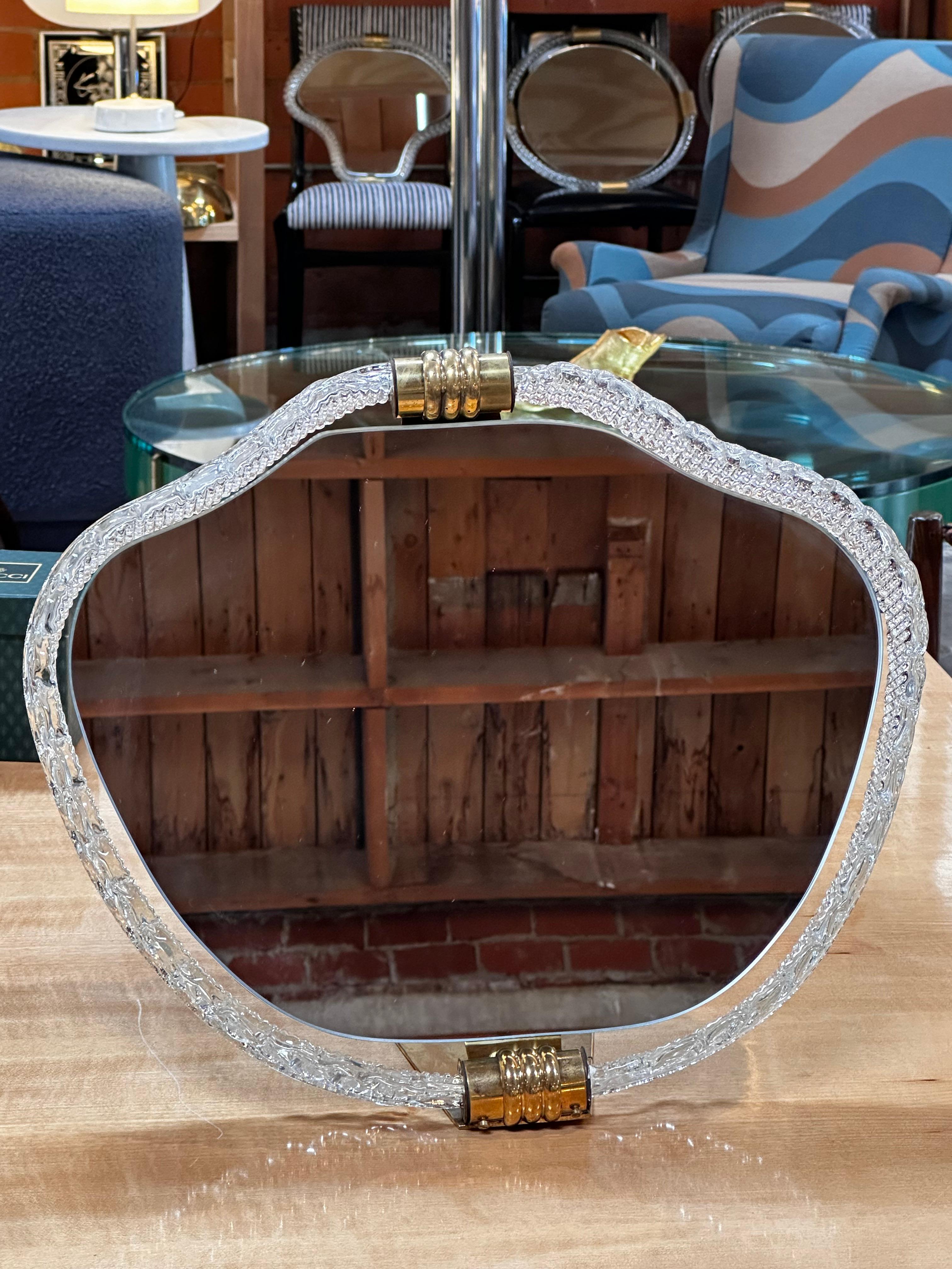 The Vintage Italian Murano Vanity Mirror from the 1940s is a classic and elegant piece of decorative furniture. Crafted in Murano, Italy, during the mid-20th century, it likely features the distinctive artistry and craftsmanship associated with