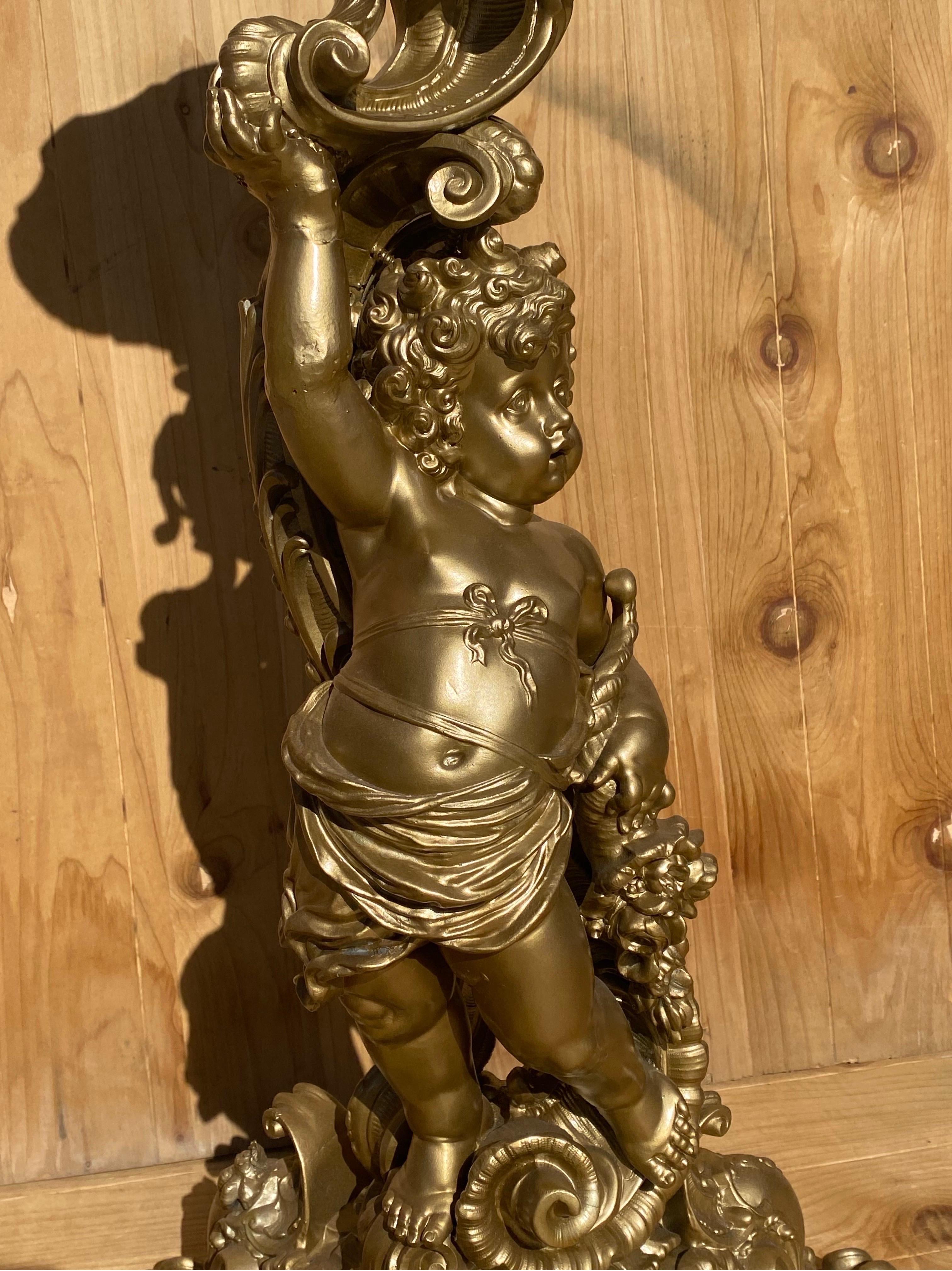 Vintage Italian Neoclassical Style Gold Ornate Cherub Putti Pedestal Plant Stand

This Vintage Italian Neoclassical style gold ornate cherub putti pedestal plant stand exudes elegance and sophistication with its intricate design and gold finish. The