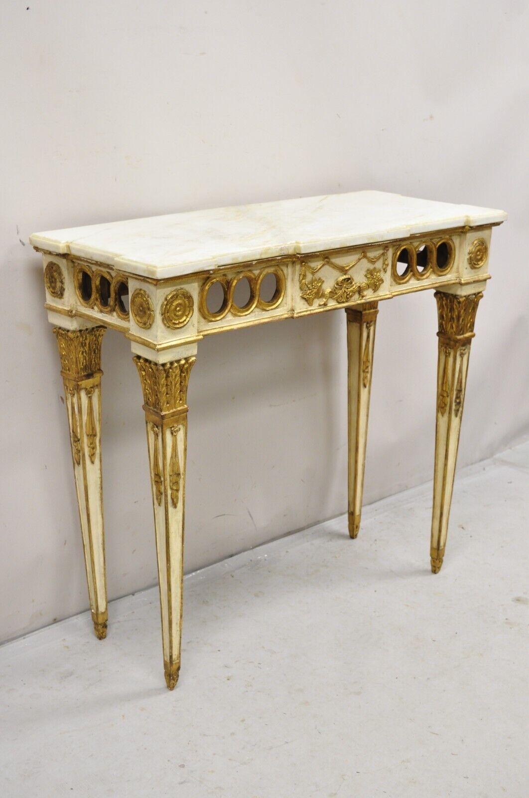 Vintage Italian Neoclassical Style Marble Top Cream and Gold Gilt Console Table. Circa 1950s.. Measurements: 36.5