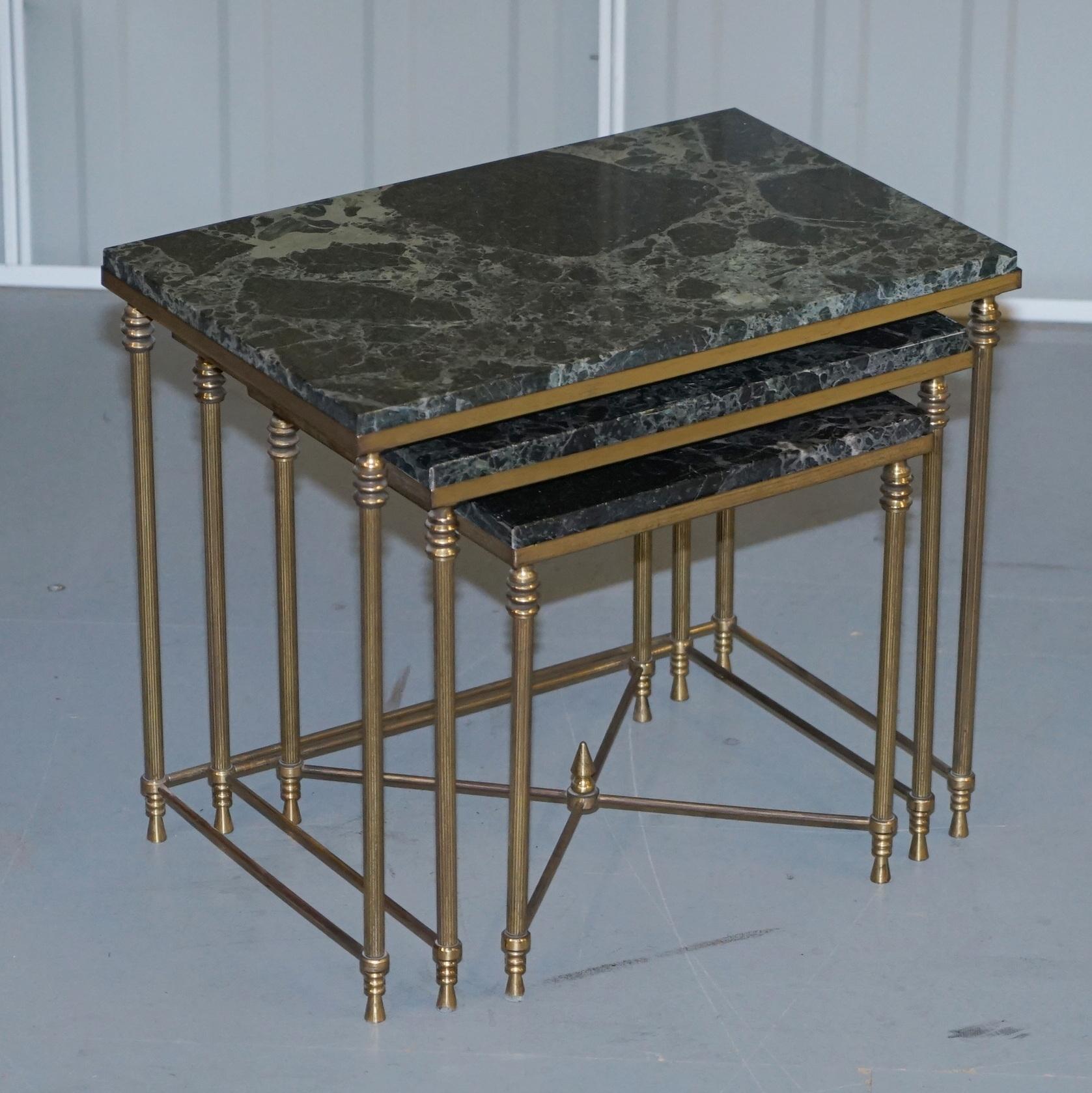 We are delighted to this stunning rare set of three original circa 1940 Italian brass nesting tables with thick green marble tops

An exquisite example, very elegant and nicely proportioned, the marble tops are oversized and recess outside the