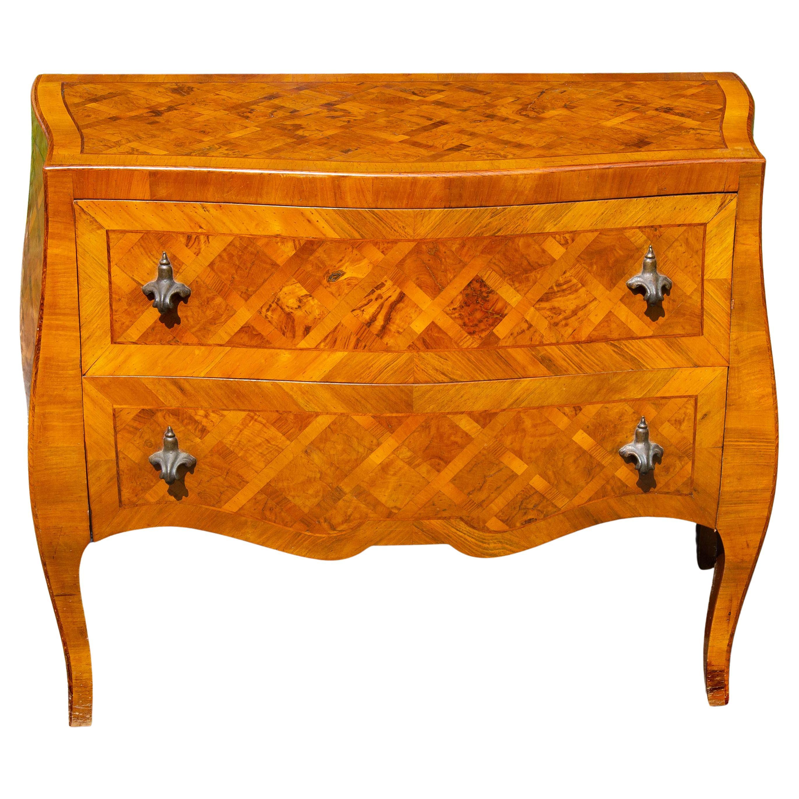 Vintage Italian two drawer bombe olive wood parquetry commode. Mid-20th century. Great color. Please, contact us for shipping options.
Presented by Joseph Dasta.