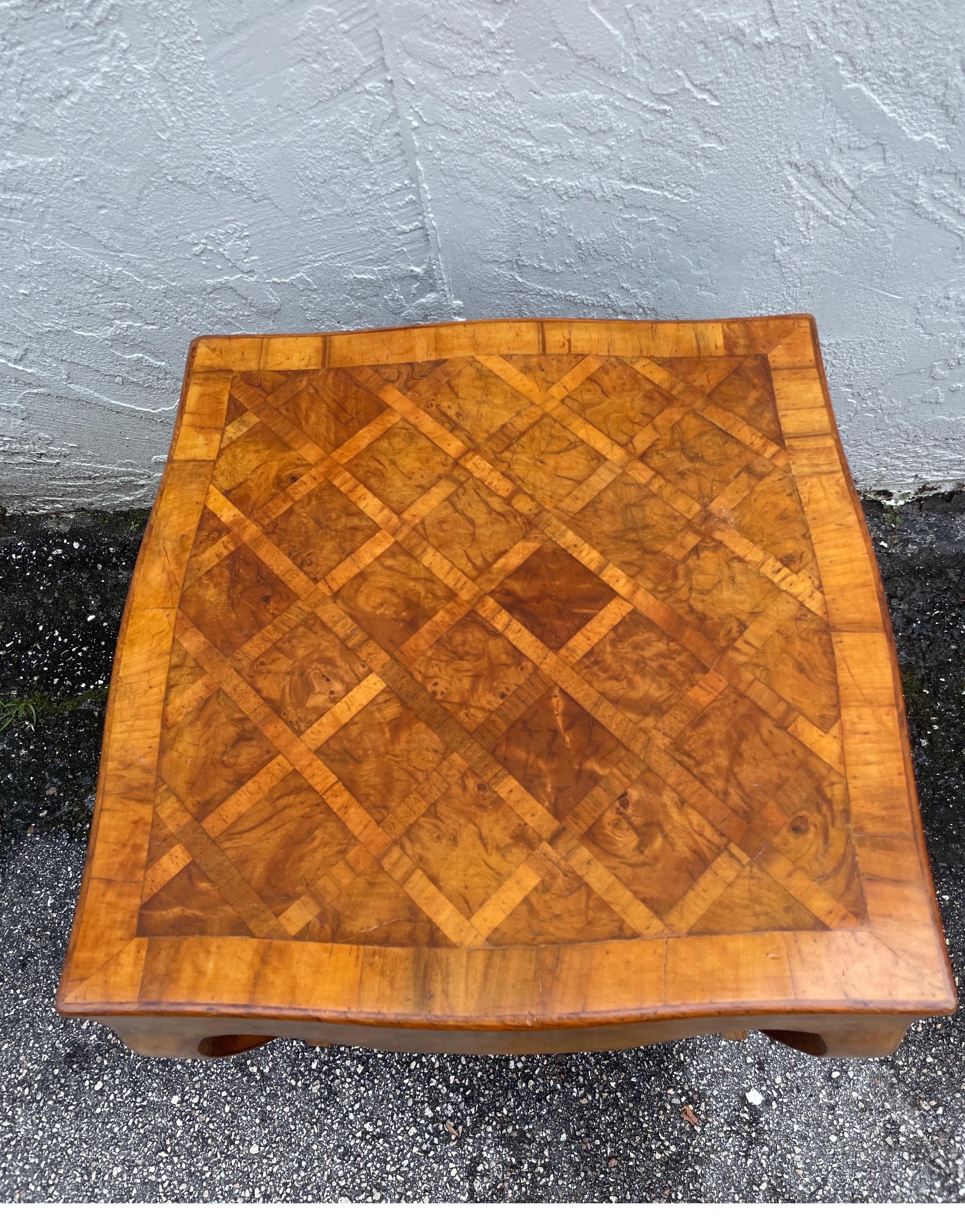 Vintage Italian Olivewood side table with cabriole legs. The table has an olivewood parquet top with a scalloped apron.