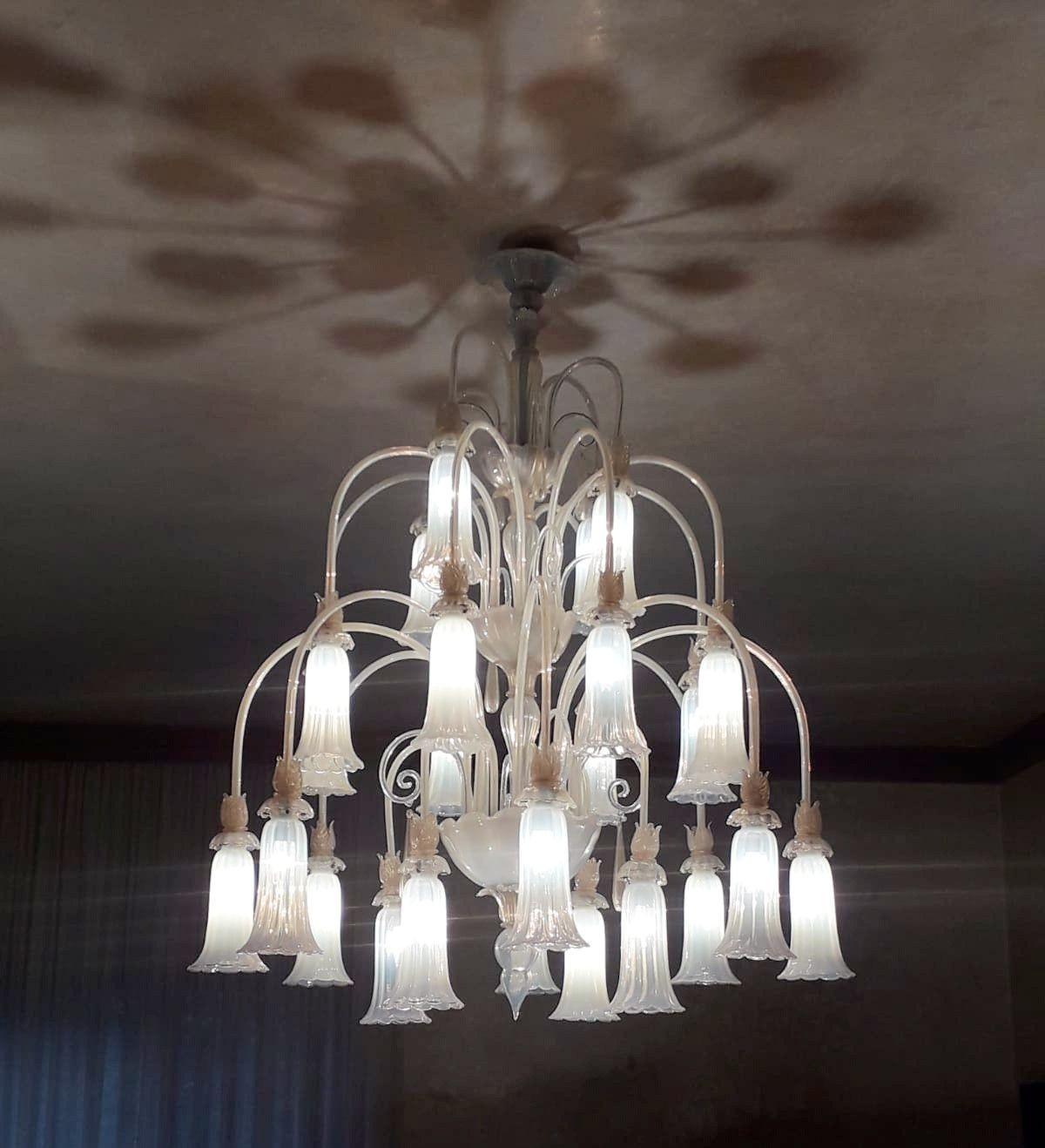 Large vintage Venetian chandelier with opaline Murano glass and decorative elements; infused with gold flecks. Made in Italy, c. 1950's.
*Rewired to fit US lighting standards.
Dimensions:
55