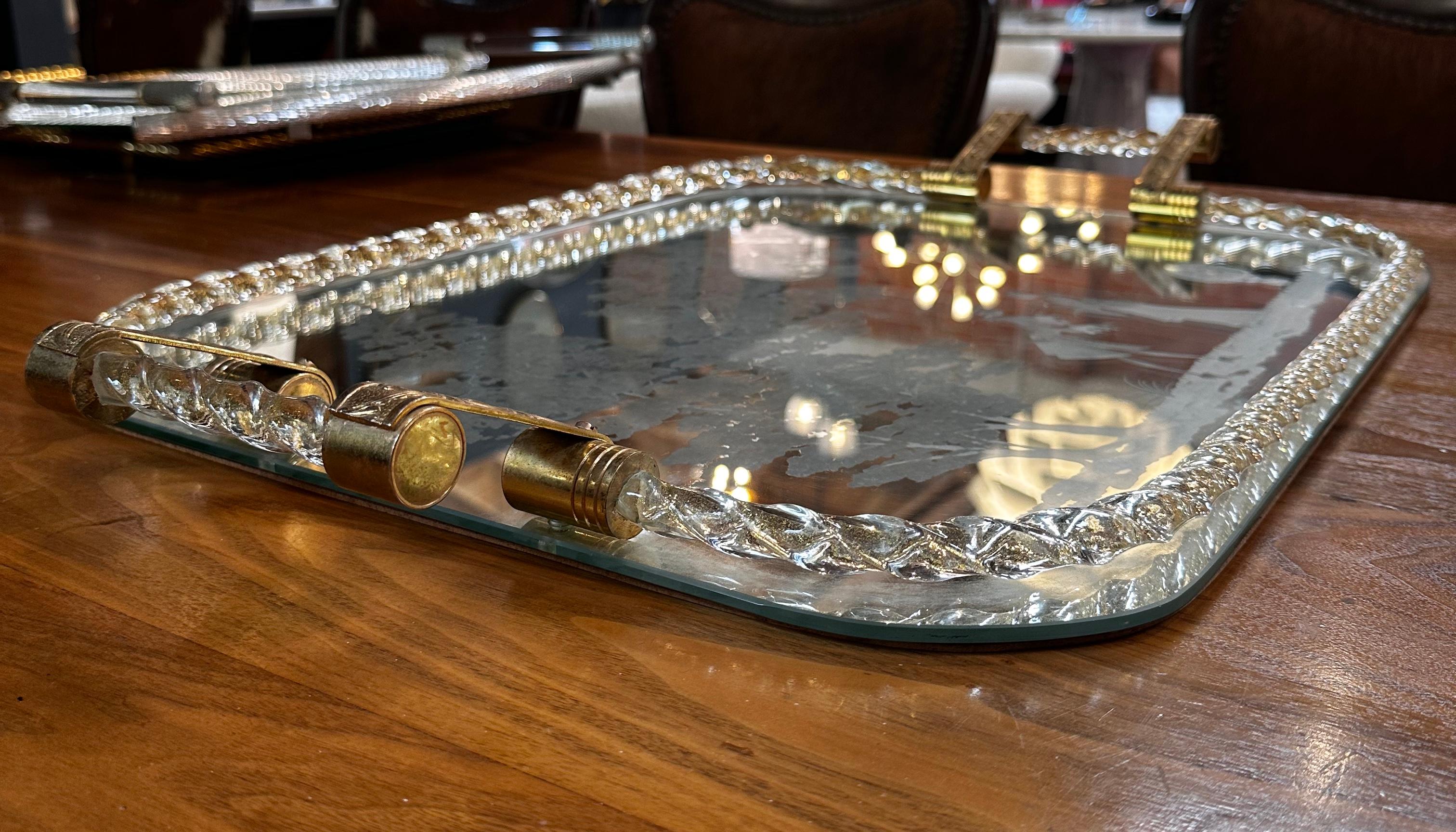 A Vintage Italian Oversize Tray from the 1960s combines the allure of Murano glass and brass, creating a stunning and spacious serving piece. This tray reflects the distinctive design aesthetics of the era, showcasing a harmonious blend of Murano
