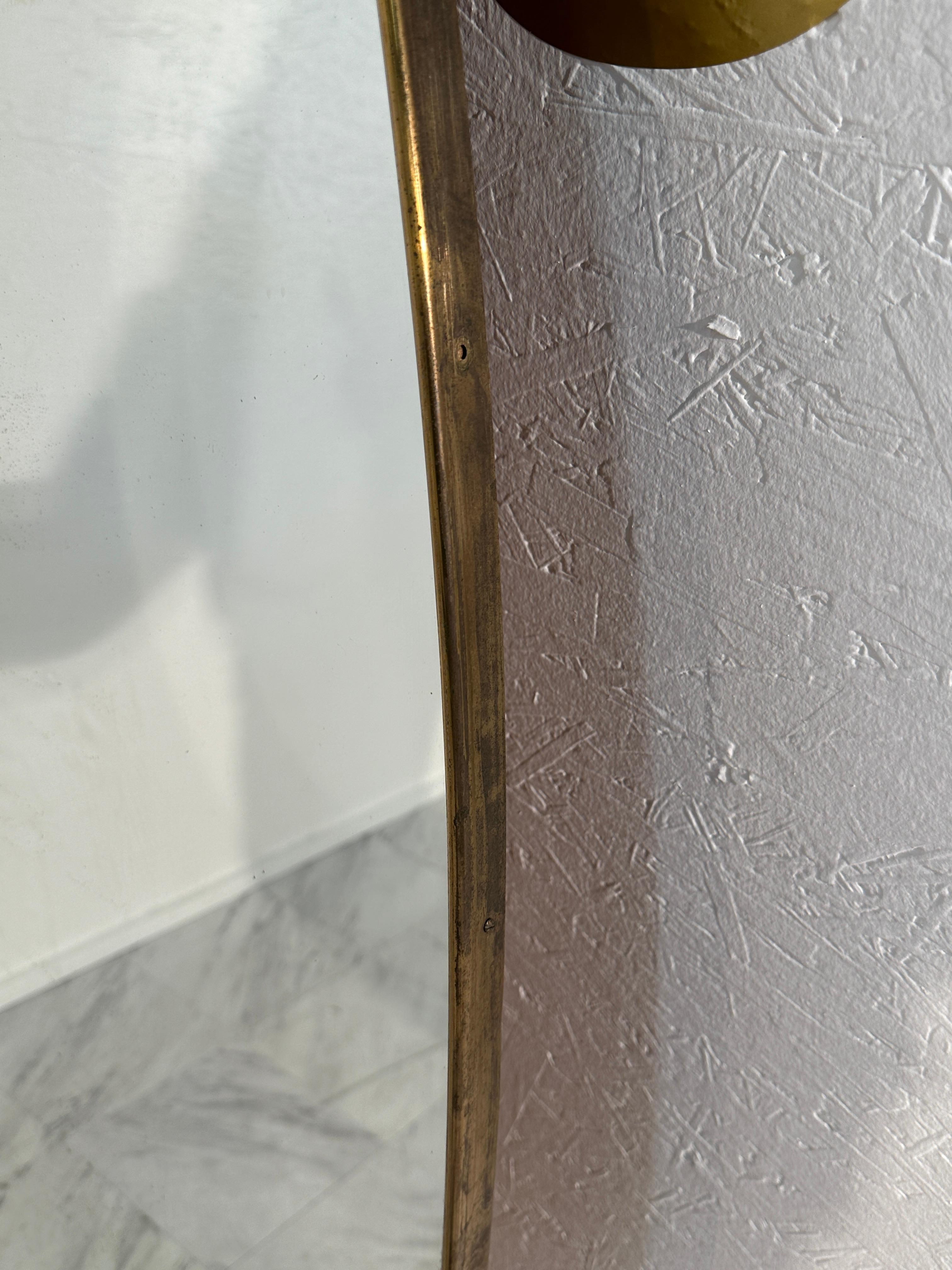 The Vintage Italian Oversize Oval Wall Mirror from the 1980s is a grand statement piece. Crafted in Italy, its generous size and sleek oval shape command attention. With a sophisticated design that epitomizes 1980s Italian aesthetic, it features a