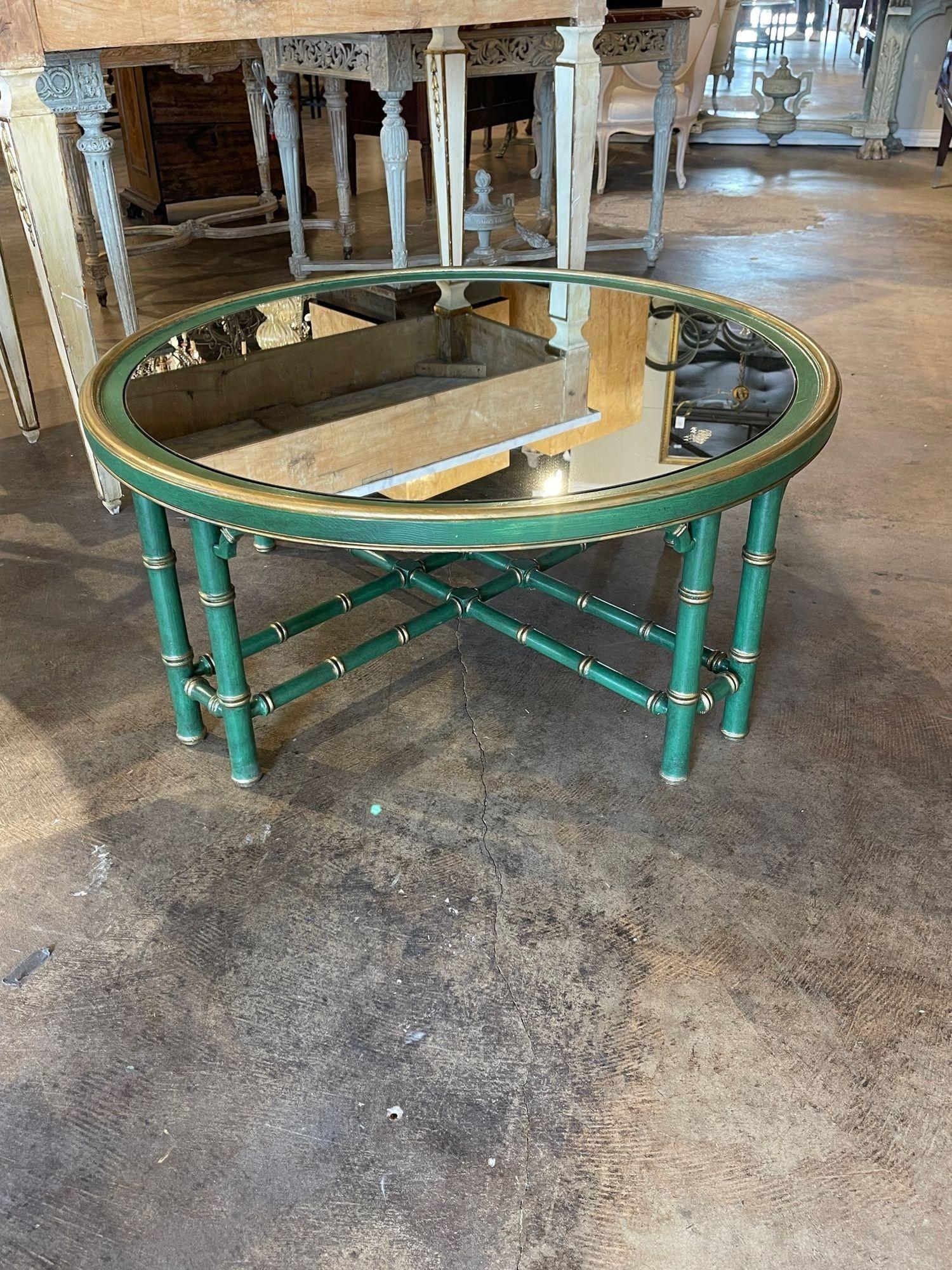 Very nice vintage Italian painted bamboo form coffee table with mirrored top. Lovely green patina with gold highlights. Creates an interesting focal point in a lovely room.