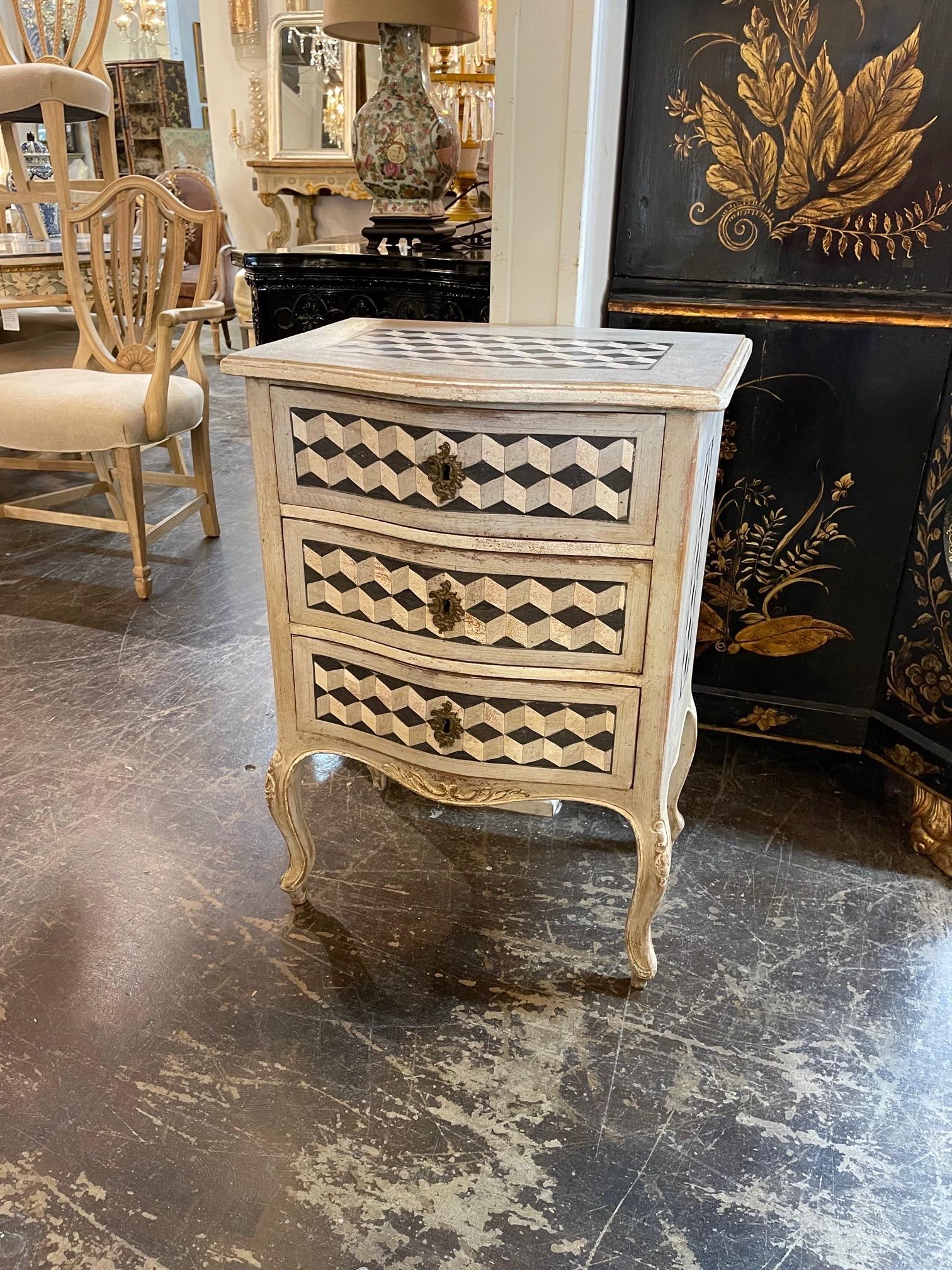 Stylish vintage Italian painted side table with a geo-metric design. Nice curved shaped and beautiful decorative design. A great accent piece!