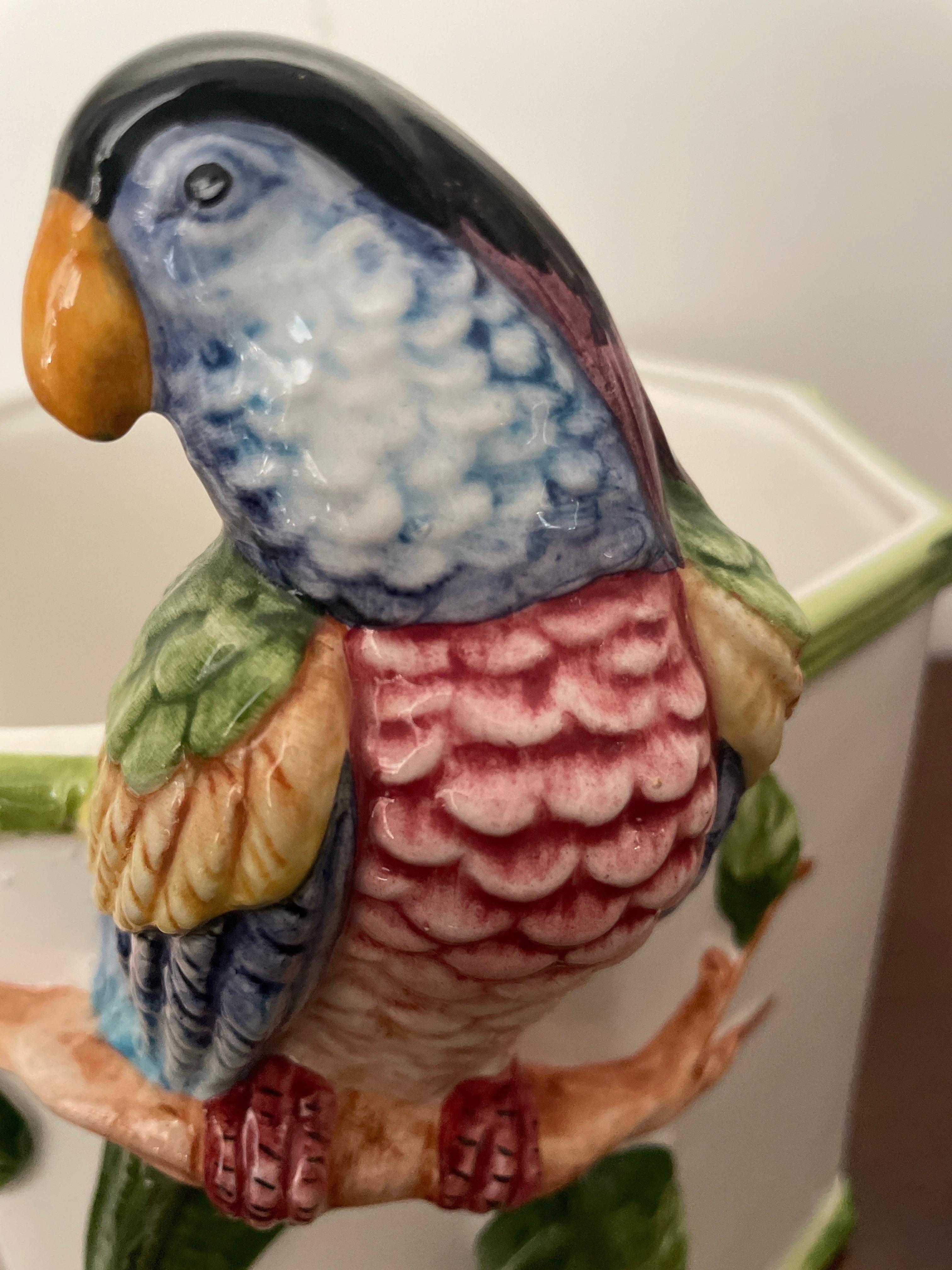 Wonderful large Italian Cache Pot in an octagon shape with green faux bamboo trim surround.
Featuring a large colorful Parrot projecting above the top.