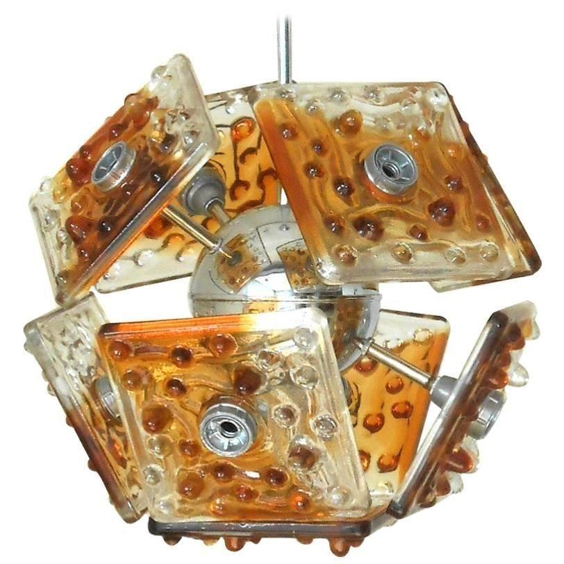 Vintage Italian pendant with clear and amber Murano glass tiles hand blown with bubbles within the glass, mounted on chrome frame. Designed by Mazzega, circa 1960s.
Made in Italy 
Dimensions:
24