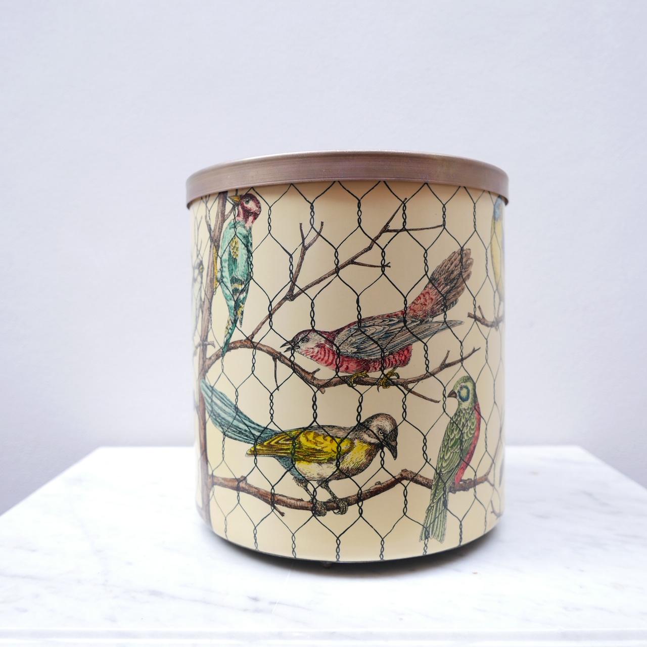 Piero Fornasetti waste paper bin. 

Italy, mid-late 20th century. 

Brass rimmed top. 

Lithographically printed metal. 

In remarkable condition, generally, some scratches internally to the base. 

 