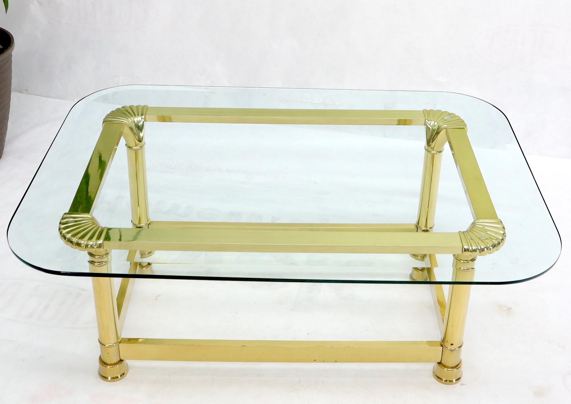 Vintage Italian polished brass bass rectangular glass top coffee table with rounded scallop shape corners.