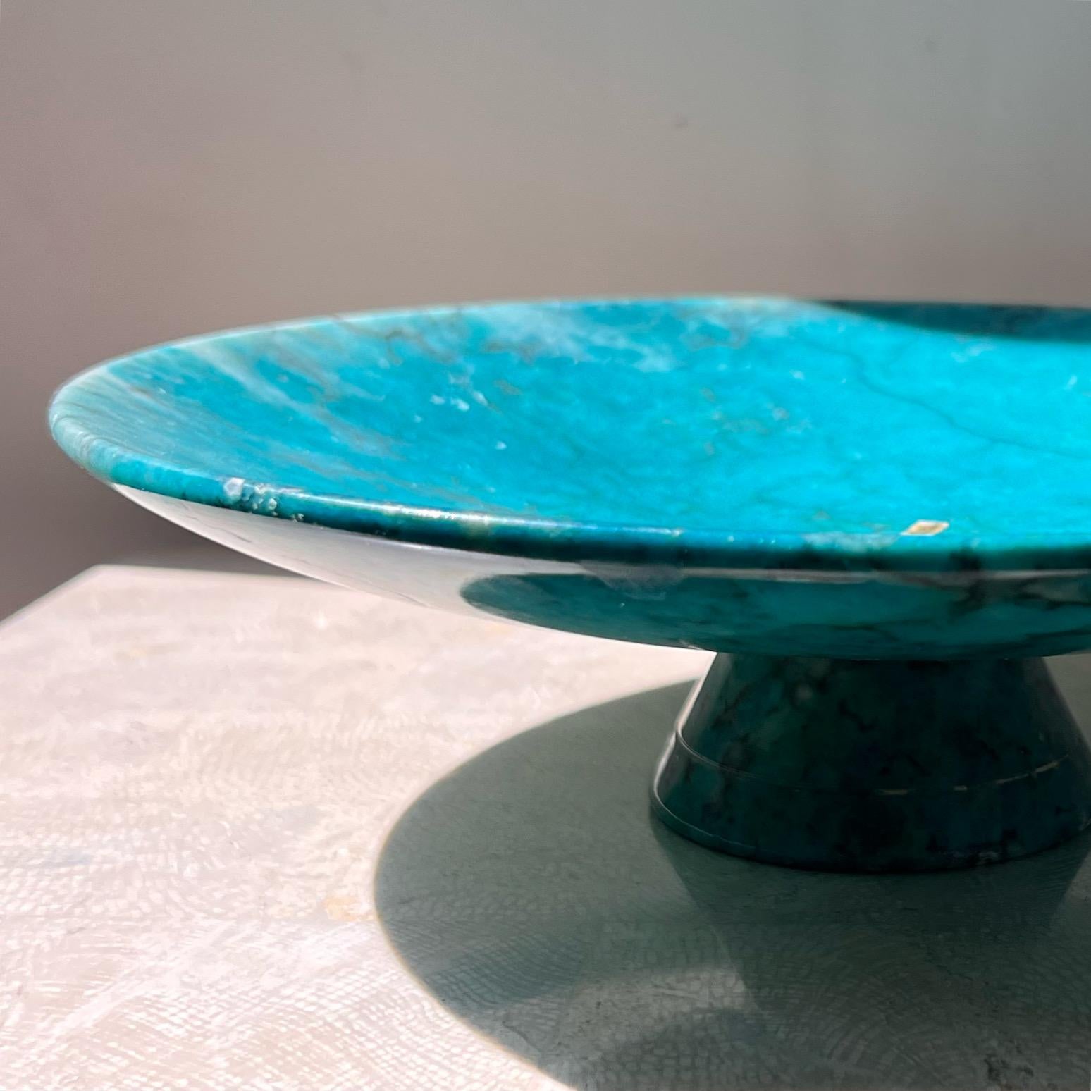 A vintage Italian marble platter / fruit bowl / centerpiece in a stunning turquoise blue, circa 1960s. Note the conical shape of the base, lending a decidedly postmodern sensibility to the piece. Original “made in Italy” sticker still intact. Good