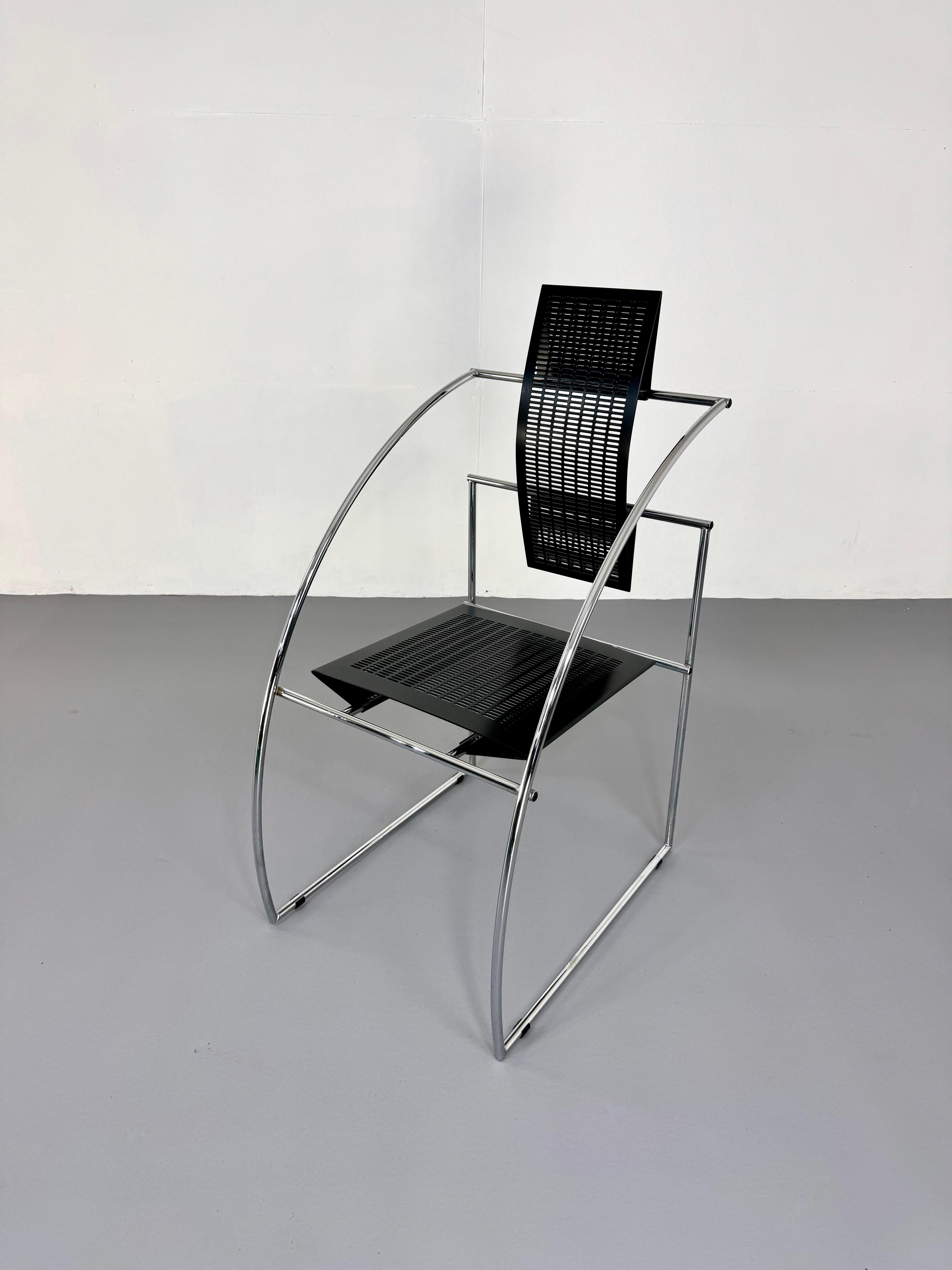 We are pleased to offer an original Quinta Chair designed by Mario Botta for Alias – a striking example of postmodern design, blending architectural rigor with sculptural elegance. This particular version is a rarer edition featuring a chrome-plated