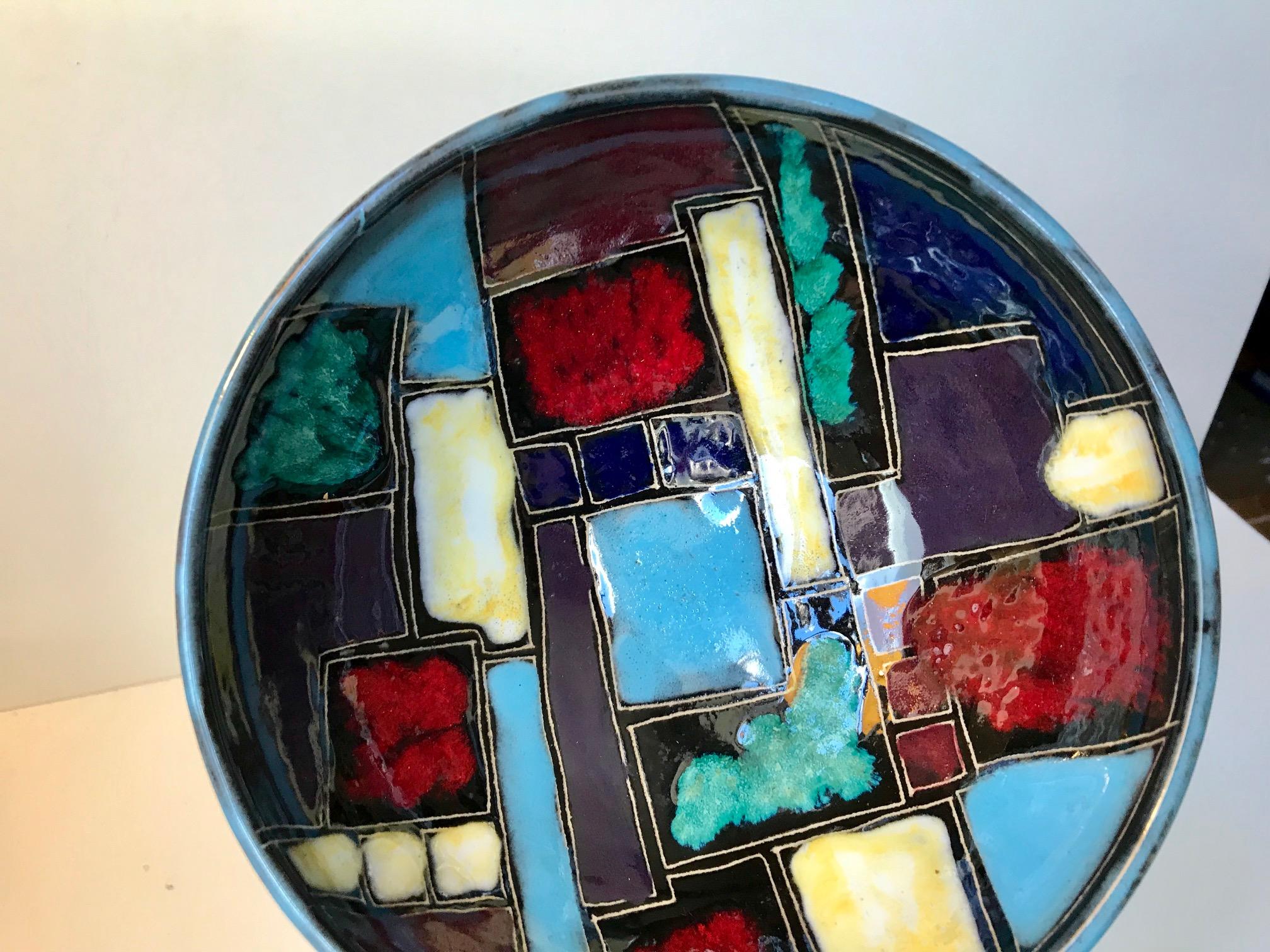 Unusual Italian ceramic dish with a palet of diffrent colored hand applied glazes. Anonymous designer or maker, circa 1960 in the style of Marcello Fantoni. The bowl has no markings.