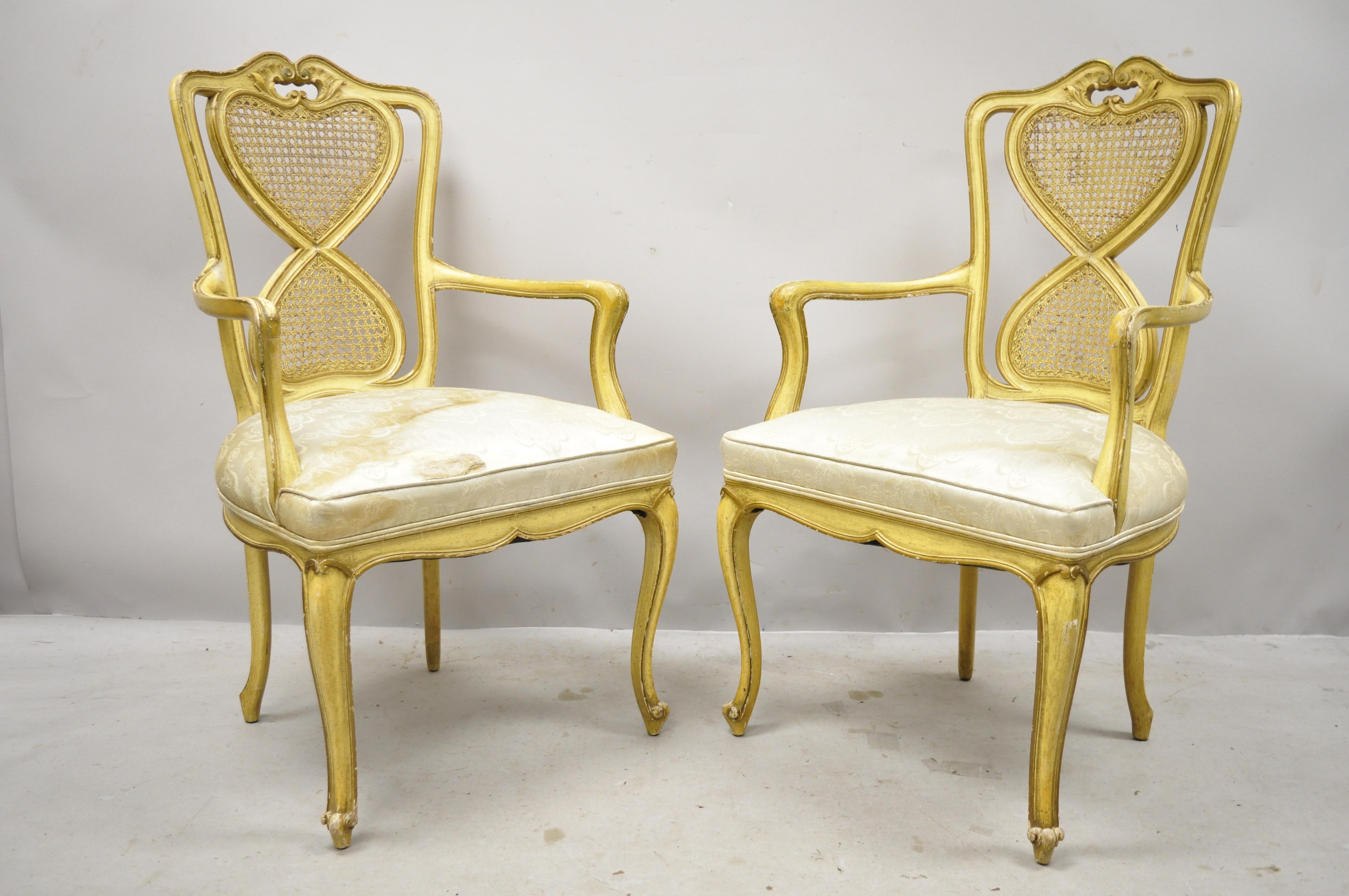 Vintage Italian Provincial French Louis XV yellow cane back dining armchairs. Item features cane backs, solid wood frame, distressed finish, cabriole legs, quality craftsmanship, great style and form, circa early to mid-20th century. Measurements: