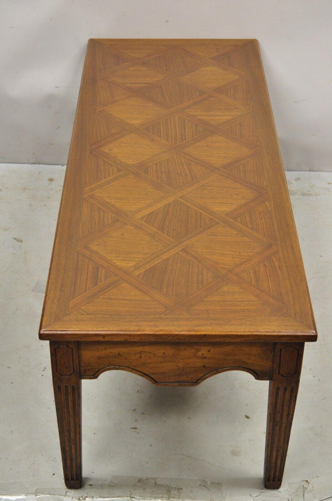 Vintage Italian Provincial Walnut French Country Parquetry Inlay Coffee Table. Item features a solid wood construction, parquetry inlay top, distressed finish, quality Italian craftsmanship. Circa Mid 20th Century. Measurements: 16
