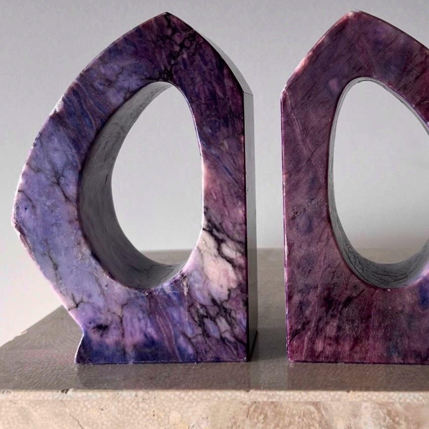 A very unique and incredibly rare pair of vintage Italian marble bookends in hand-carved geometric form, circa mid 1960s. Glorious tones of amethyst, lilac, and aubergine with cream and charcoal veining. Some scrapes and minor losses but no glaring