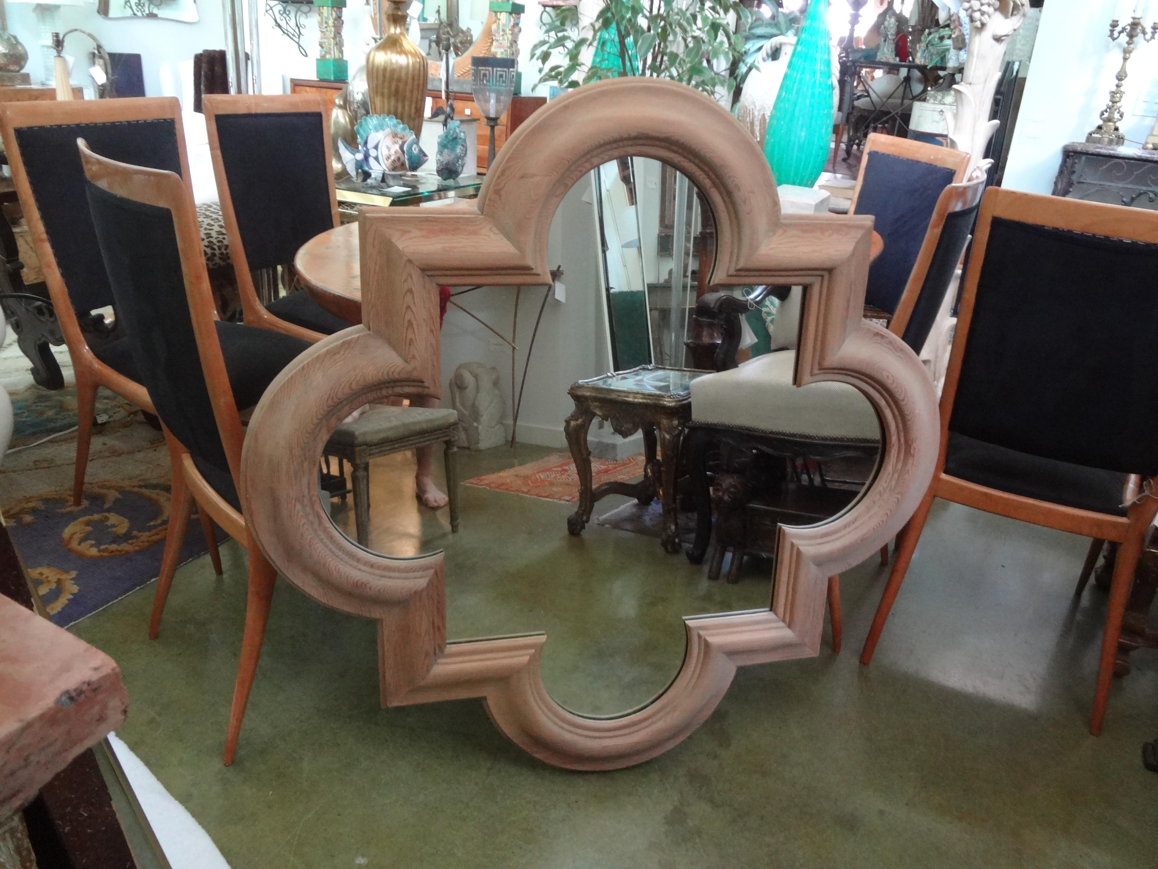 Large Italian quatrefoil wood mirror.
Stunning large Italian quatrefoil mirror of solid oak. This beautifully carved well-made oak mirror dates to the 1970s and is in great condition. This vintage Italian mirror could be gilded, cerused, lacquered