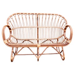 Divanetto o poltrona in rattan italiano d’epoca nello stile di Franco Albini