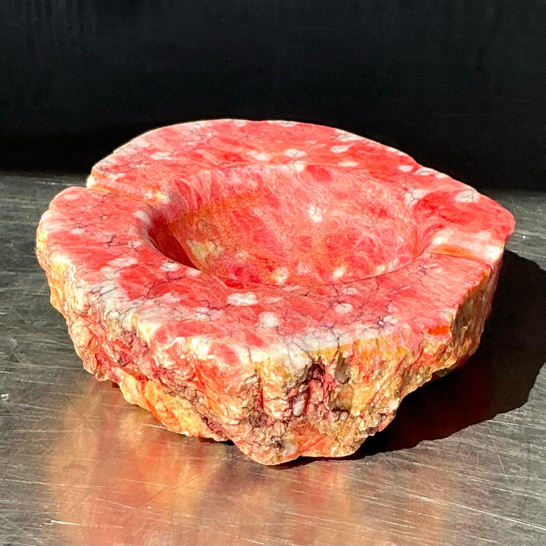 This exquisite vintage Italian marble ashtray embodies natural elegance with its raw-edge design and vibrant coral hue. Handcrafted from premium marble, it showcases a textured surface with polished highlights, blending rustic charm and refined