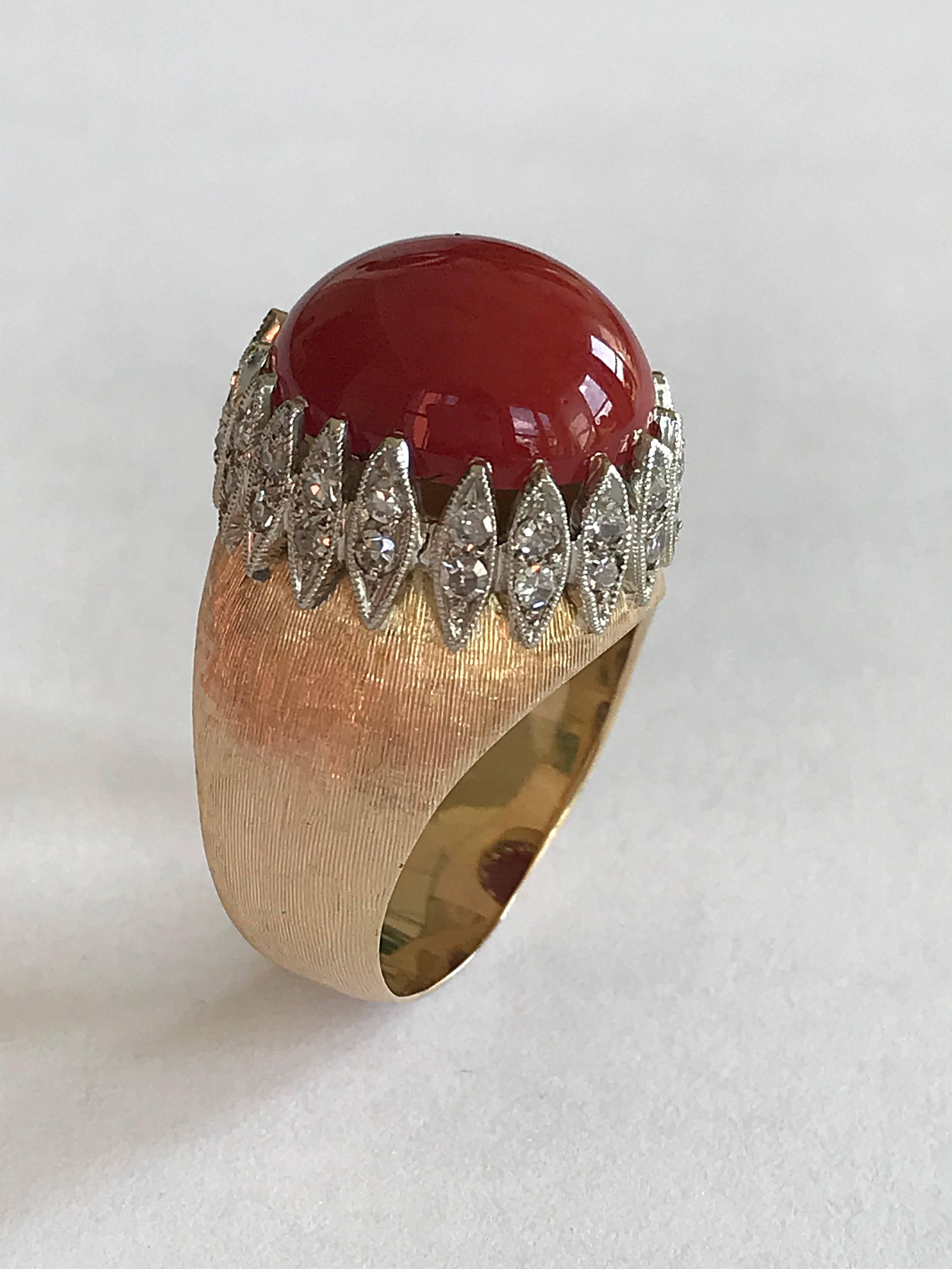 Vintage Italian warm yellow and white gold ring with 36 diamond weighting circa 0,5 carat and a red natural mediterranean cabochon cut coral “Corallium Rubrum”  weight 6,9 carat.
The ring has been made probably between 1940 and 1950.
The yellow gold