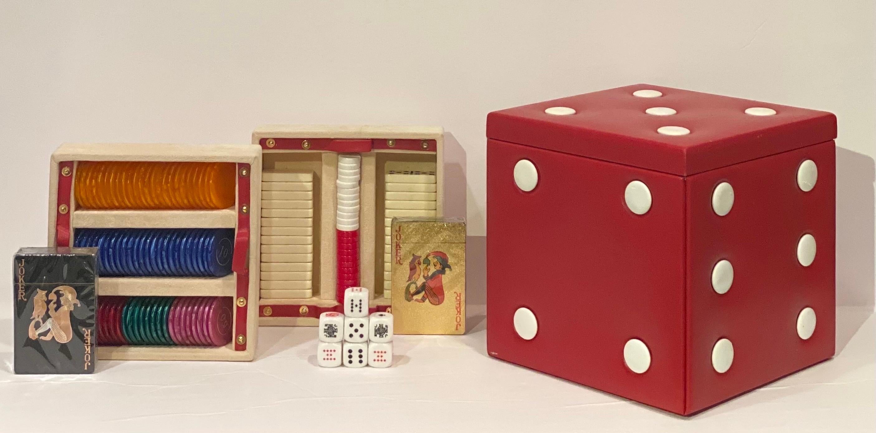 We are very pleased to offer a vintage game box, made in Italy, circa the 1960s. Neatly arranged in a red vegan leather case and a suede interior, this carrying case is both a lovely decor piece and a ready-to-play game anyone can enjoy. With a