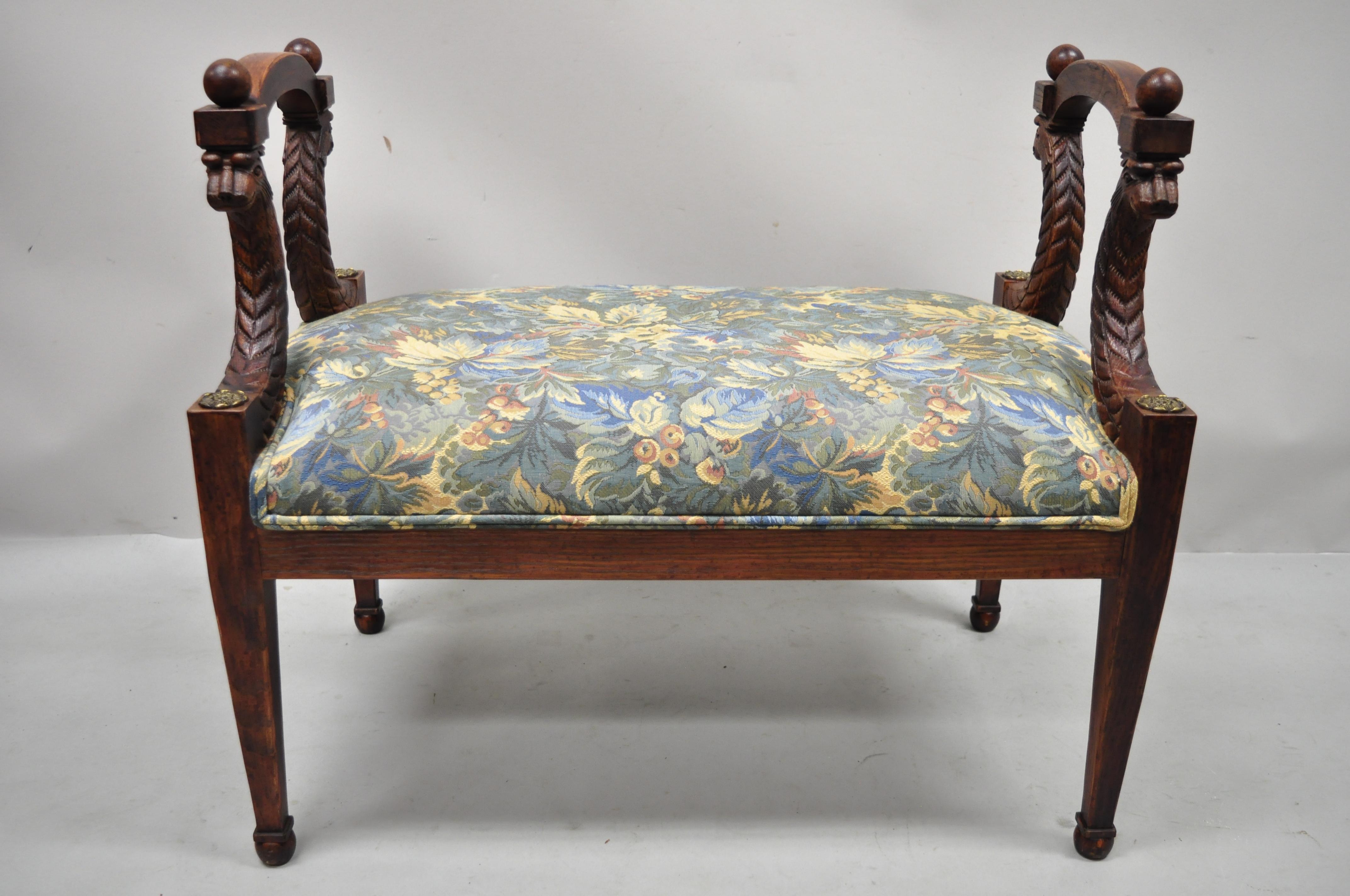 Vintage Italian Regency style figural carved floral upholstered wooden window bench. Item features faces carved to frame, solid wood frame, upholstered seat, distressed finish, nicely carved details, tapered legs, very nice vintage item, great style