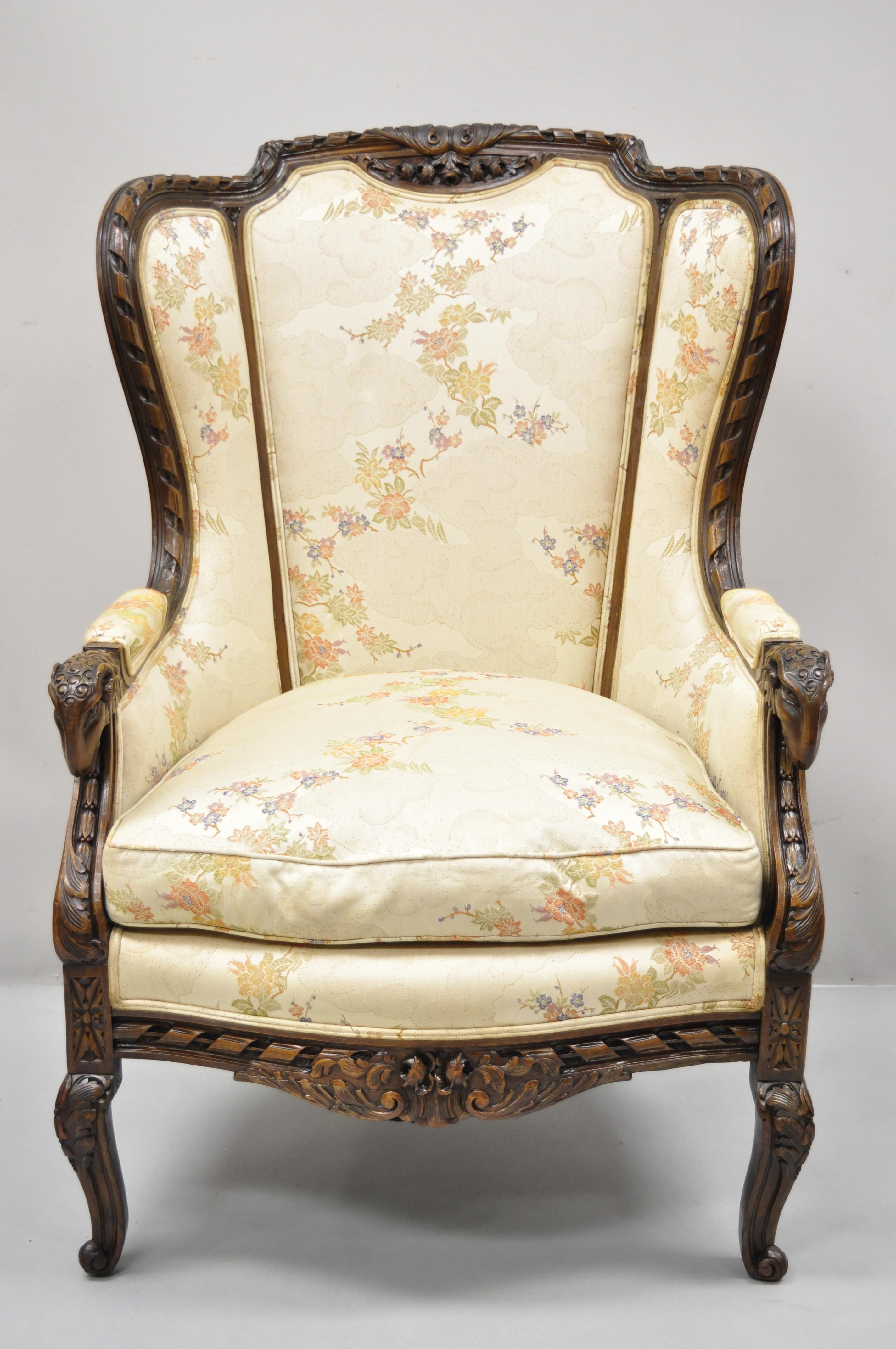 Vintage Italian Regency style rams head carved walnut wingback bergere arm chair. Item features ram's head carved armrests, solid wood frame, upholstered armrests, finely carved details, cabriole legs, very nice vintage item, great style and form.