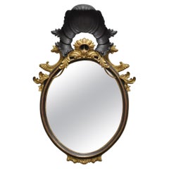 Specchio da parete ovale d'epoca in stile Regency italiano, intagliato a conchiglia e legno dorato