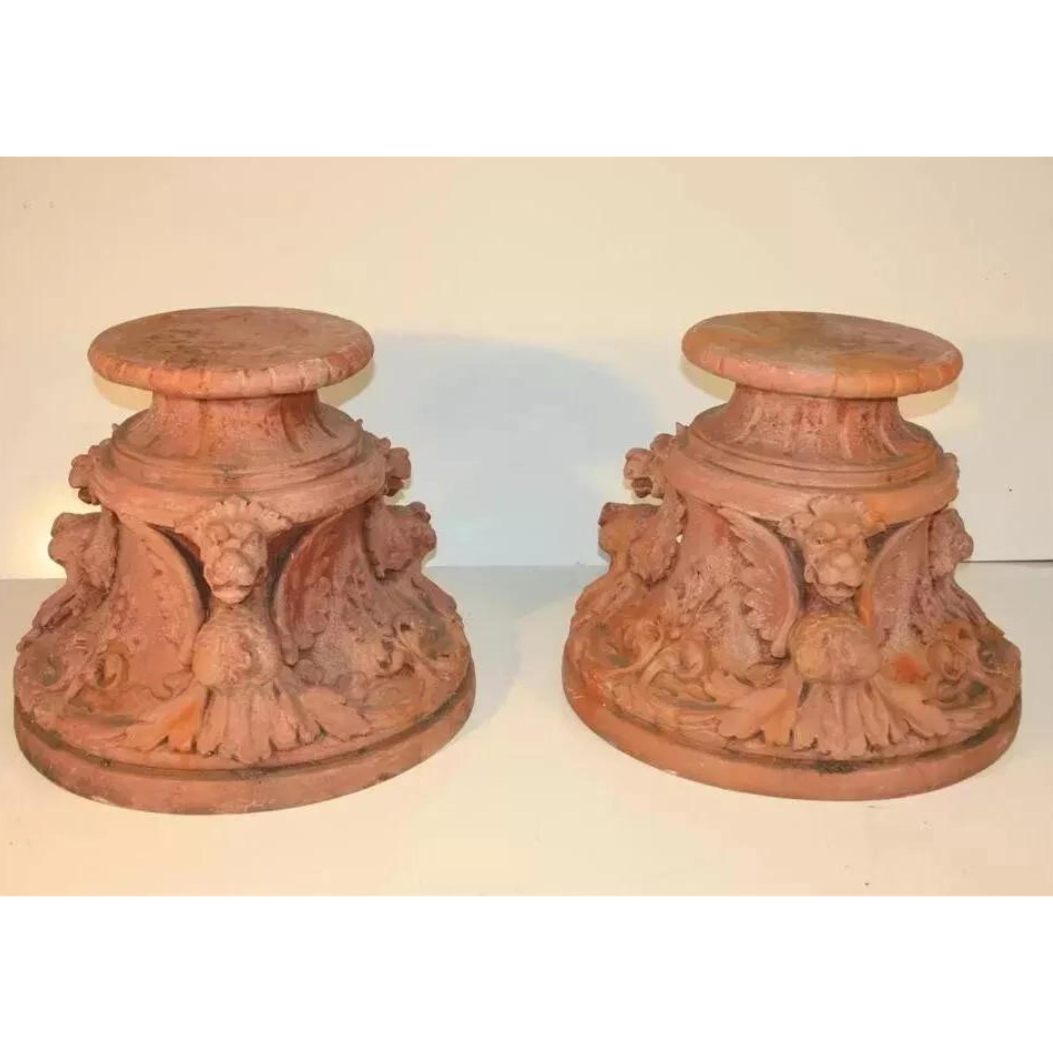 Vintage Italian Renaissance Style Winged Griffin Cast Fiberglass Garden Pedestal Stands Made to Look like Weathered Terracotta - a Pair. Circa Mid 20th Century.
Measurements: 
19