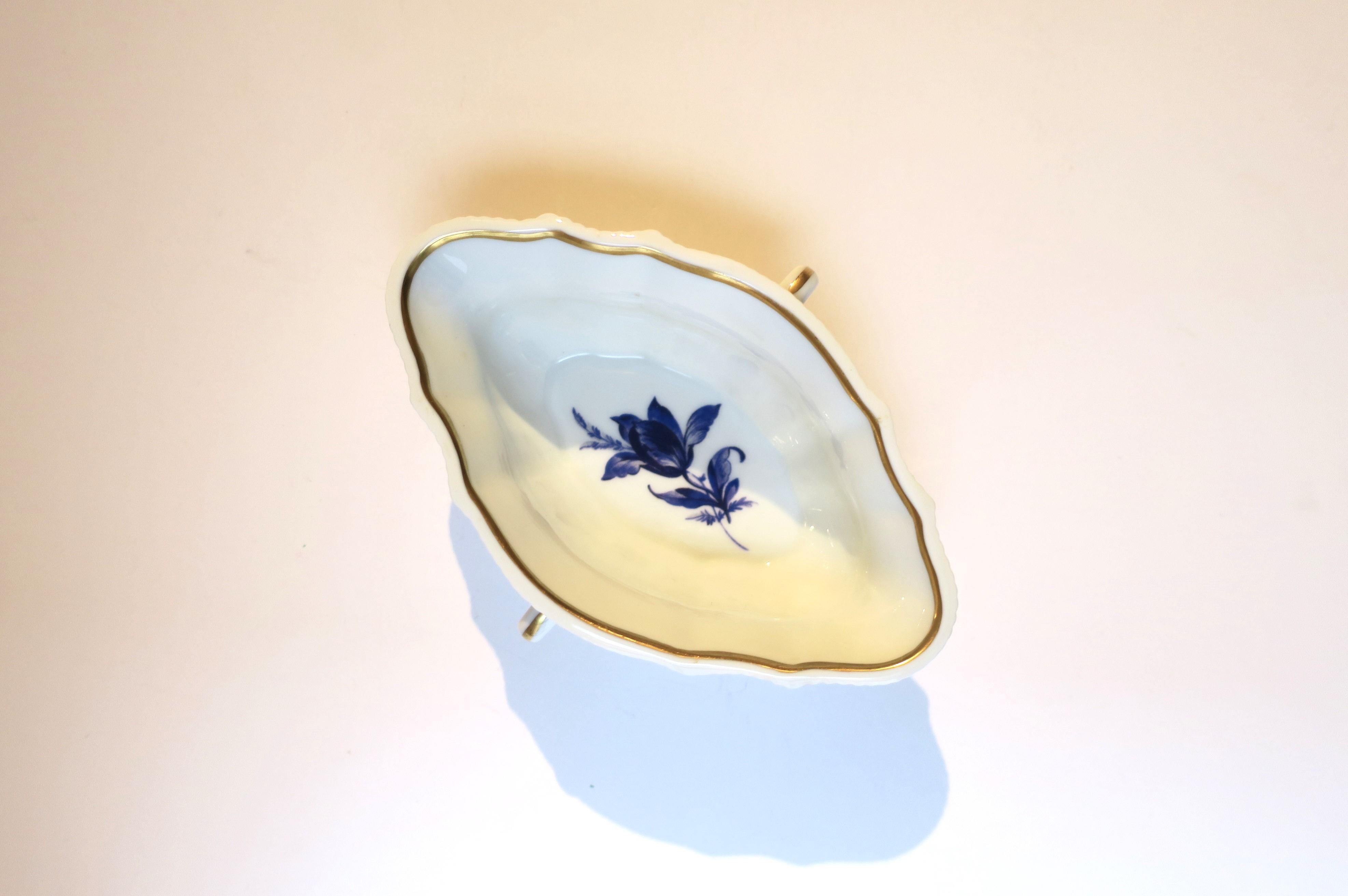 A vintage Italian white and blue porcelain bowl by designer Richard Ginori, circa mid-20th century, Italy. Bowl with handles is white glazed Italian porcelain with blue flower design at center and gold hand-painted detail on edges. A great piece for