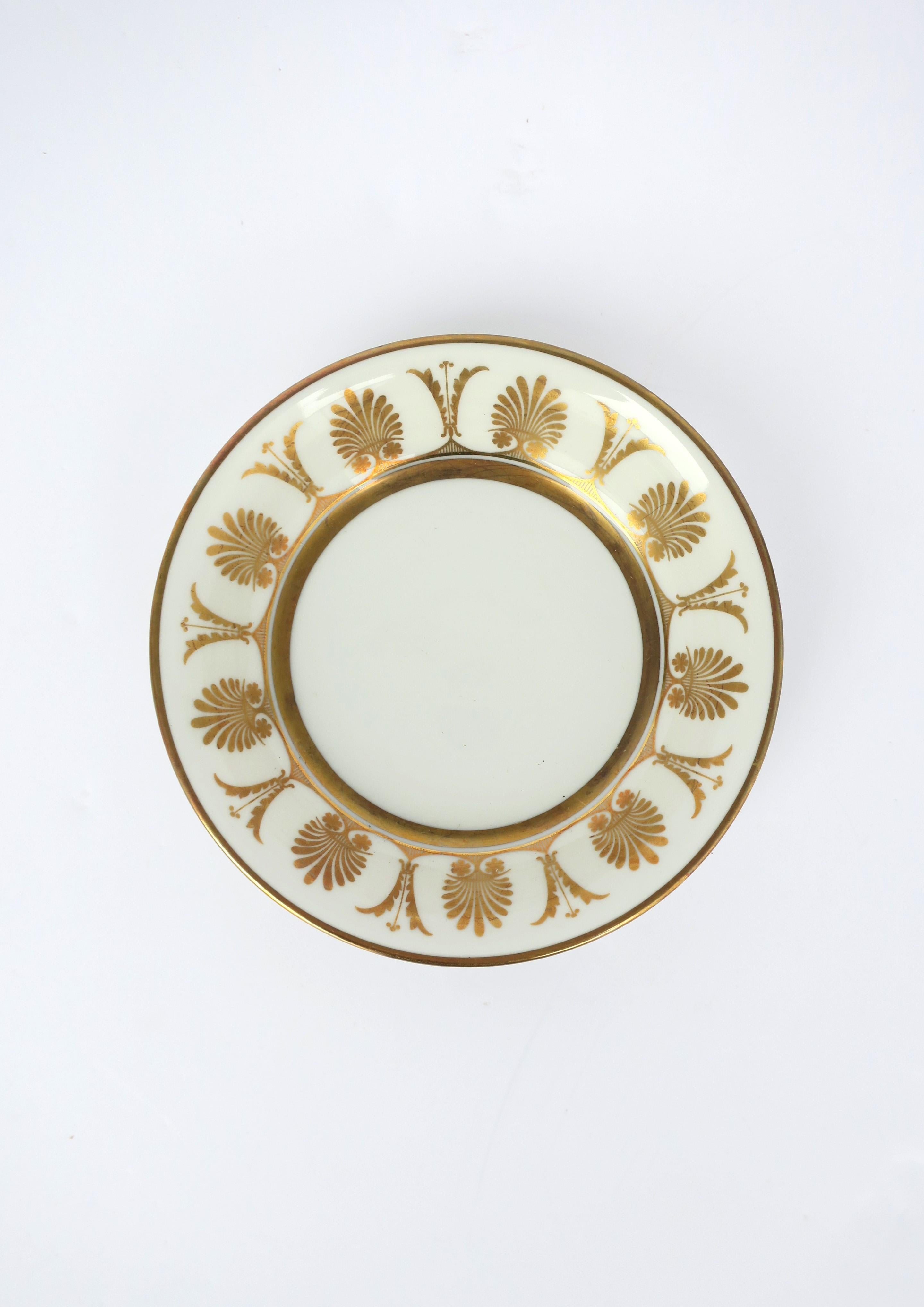 A vintage Italian white porcelain dish or bowl with gold detail by designer Richard Ginori, circa mid-20th century, 1960s, Italy. Dish was probably part of a larger set; however, I'm showing it as jewelry dish (demonstrated.) Bowl/dish may also hold