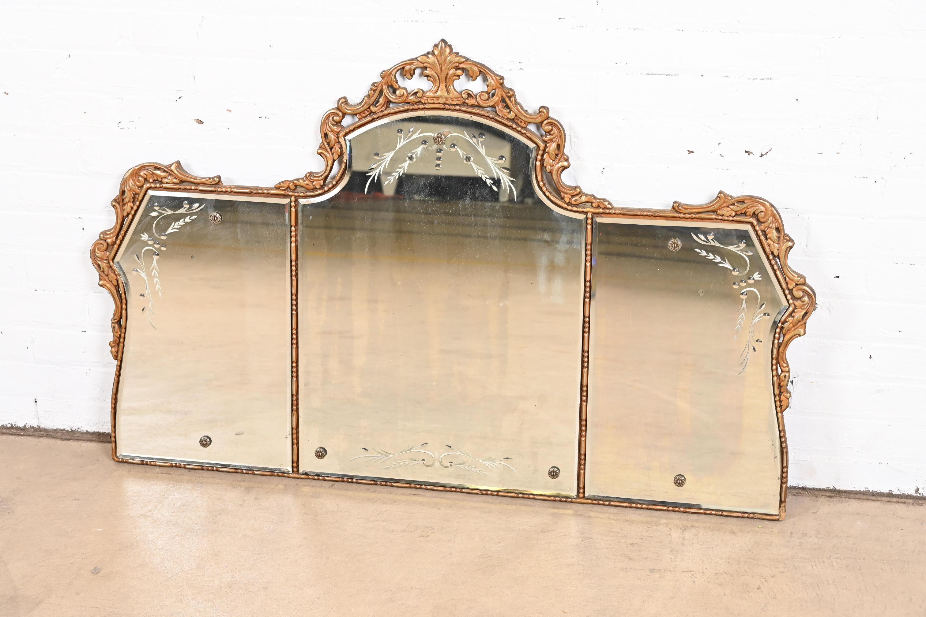 A gorgeous vintage Italian Rococo style carved & etched giltwood framed beveled wall mirror

Early 20th century

Measures: 45.75