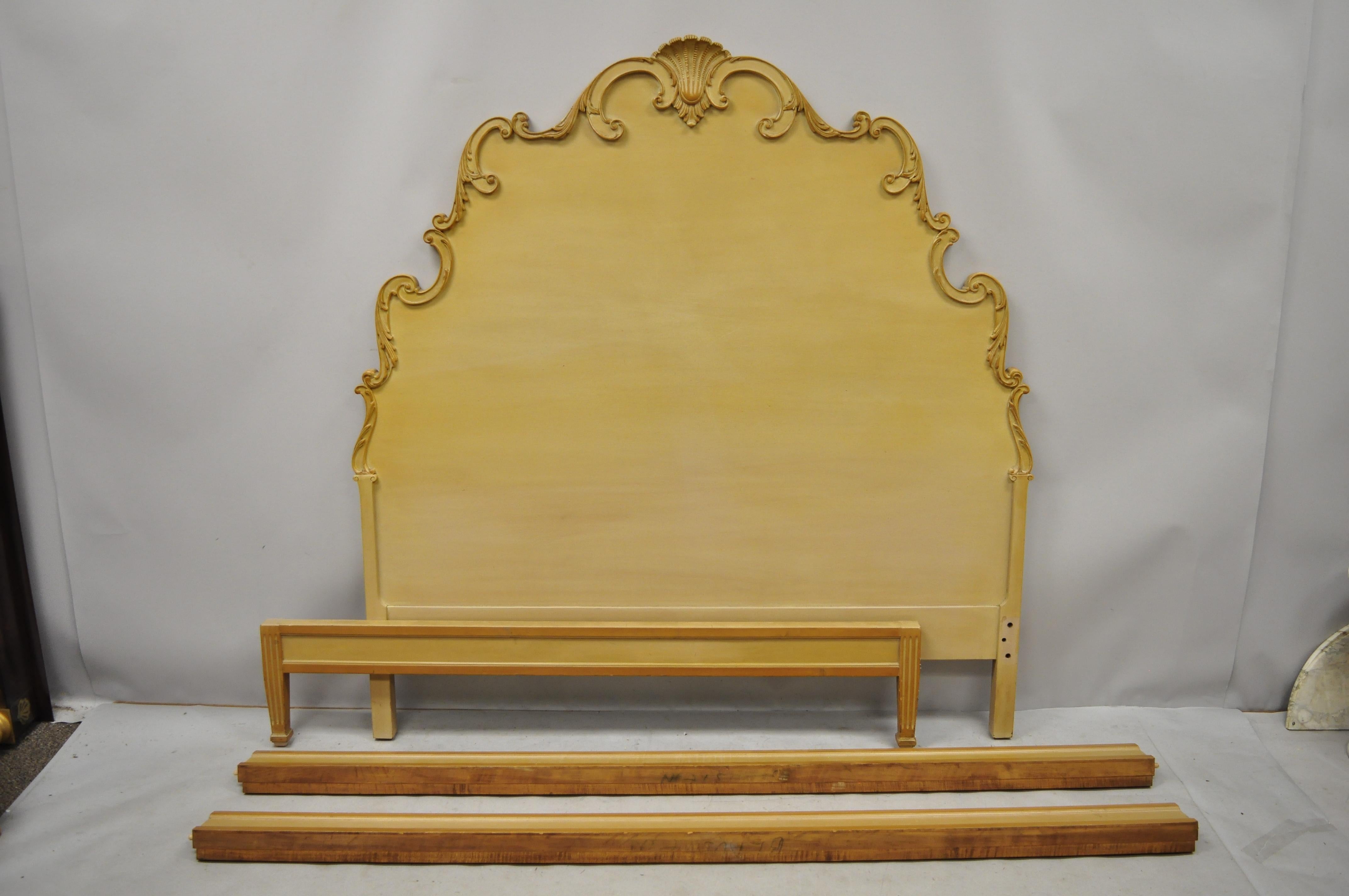 Vintage Italian Rococo shell carved ornate wooden full size bed frame. Item features a tall ornate scrollwork shell carved headboard, low profile footboard, bolted rails, lightly whitewashed finish, nicely carved details, great style and form. Fits