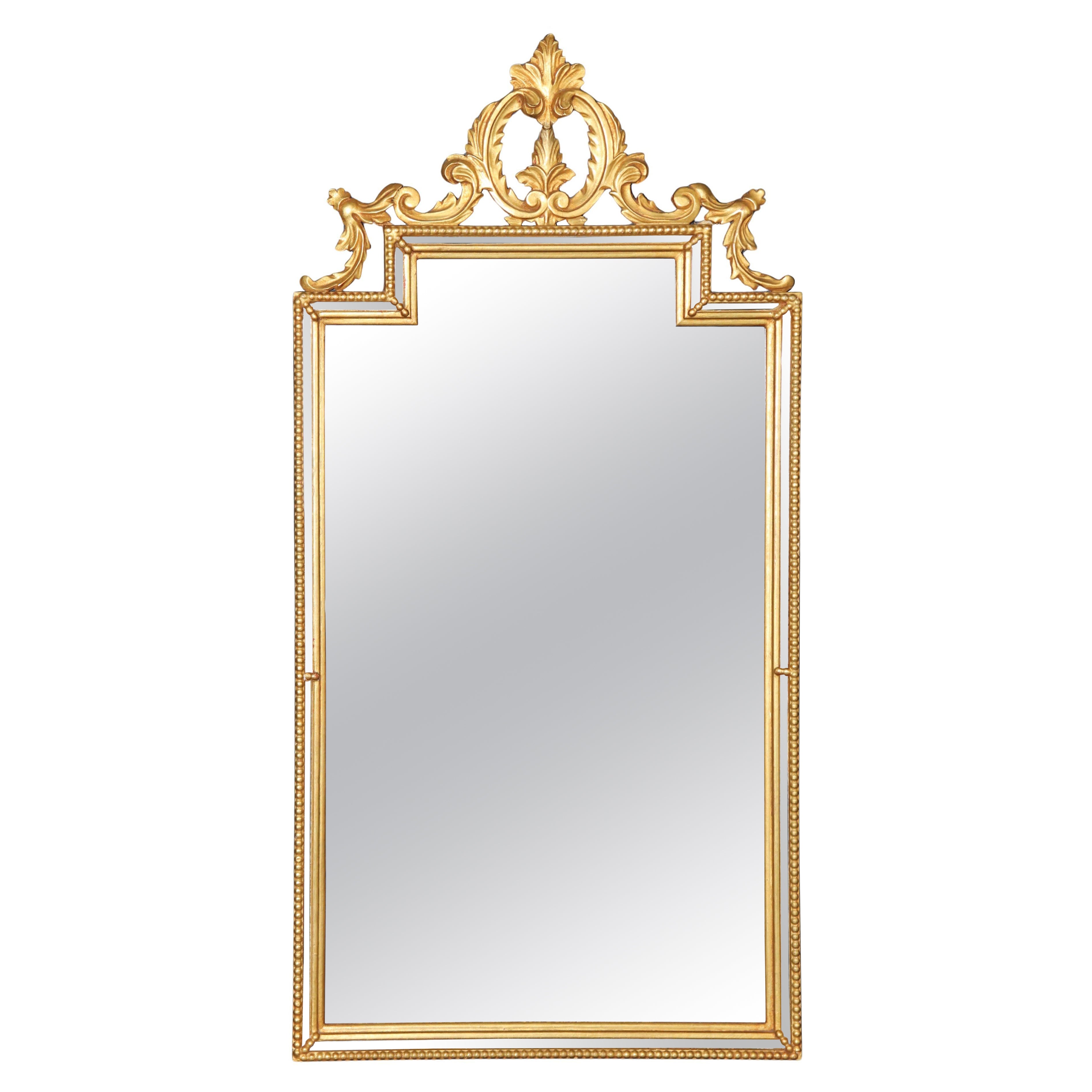 Miroir italien de style rococo sculpté et doré